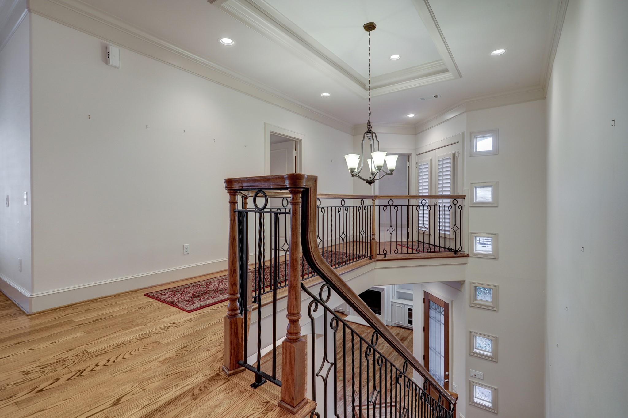Hall to the 2 secondary bedrooms and their baths. Hardwood floors and beautiful moldings.