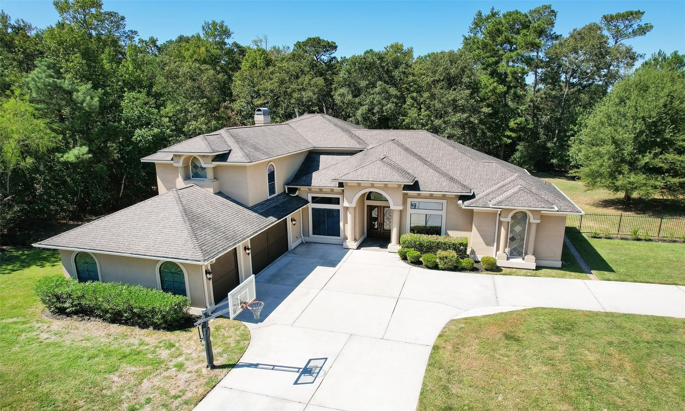 Sprawling home sits on a one acre lot with circle drive in the front