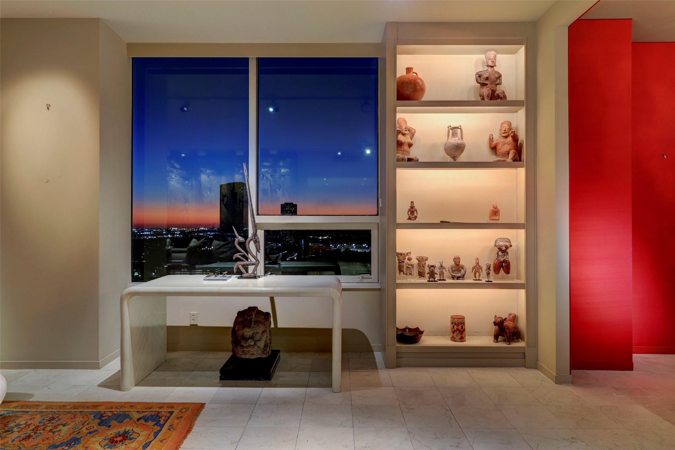 Lighted shelves frame the living room and are the perfect display case for all your treasures...check out the view though!!