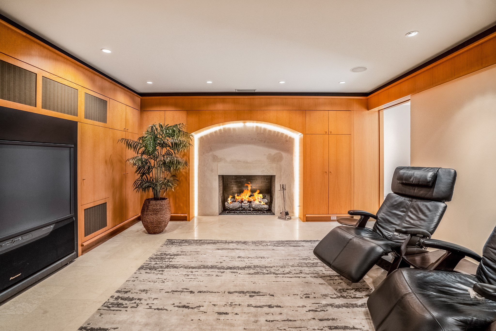 Welcome inside this stately media room/library.  Recessed lighting, gas fireplace, ample storage in the walls here.