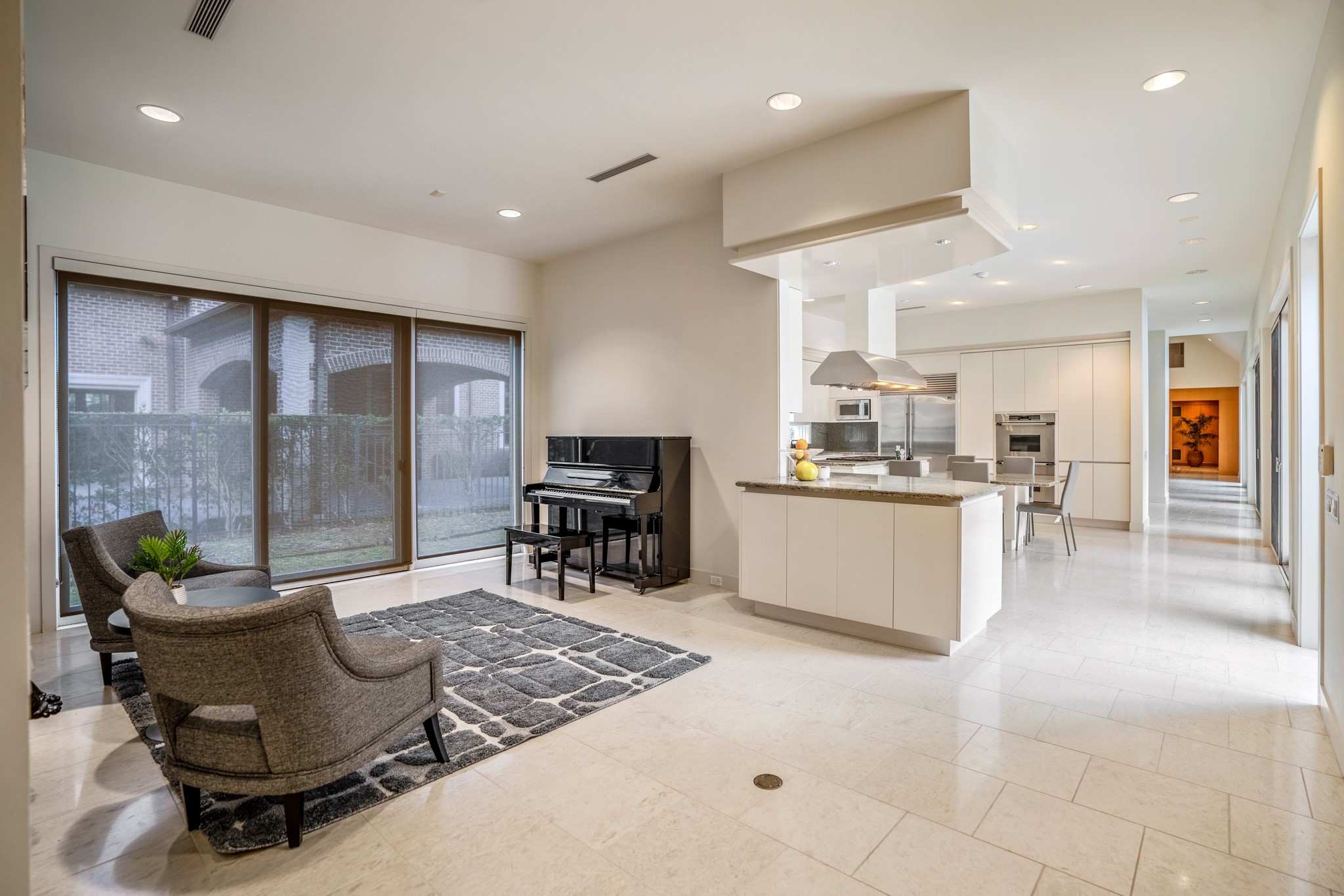 Just behind the kitchen is another flex space, flanked by windows/sliding glass doors on both sides. This flex space can be a play area for the kids, sitting room, reading room, or even workout space.