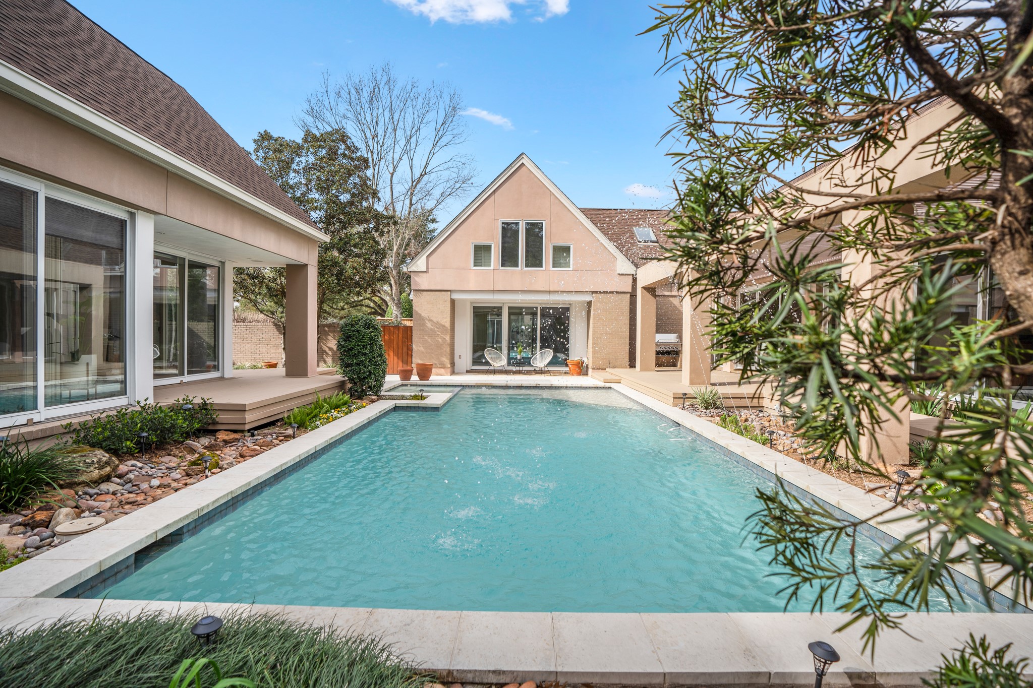 This is what your friends and family see upon entry to your home: a zen, private courtyard with a beautiful pool.