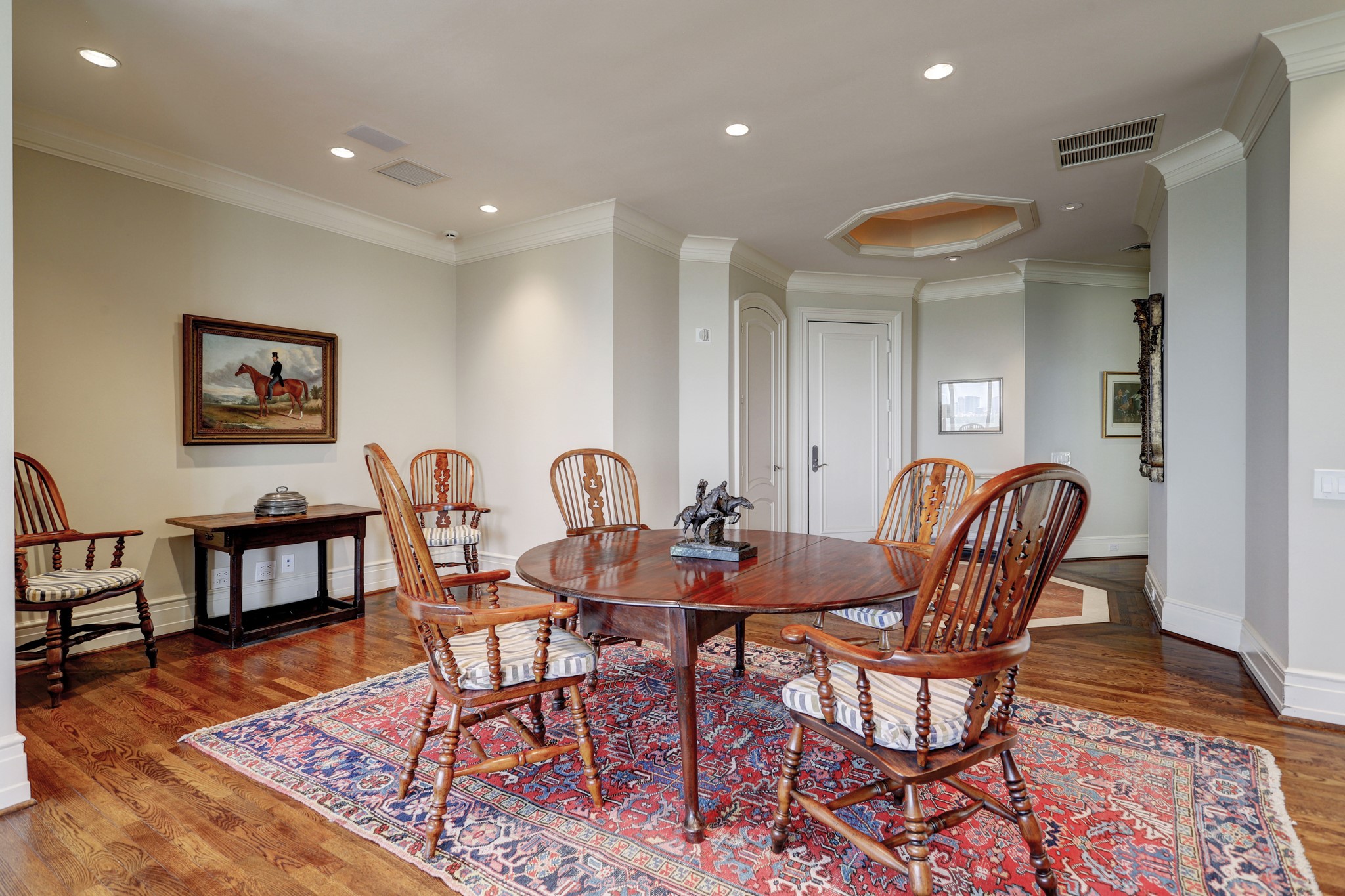 The dining and living area are light and open with views of River Oaks.