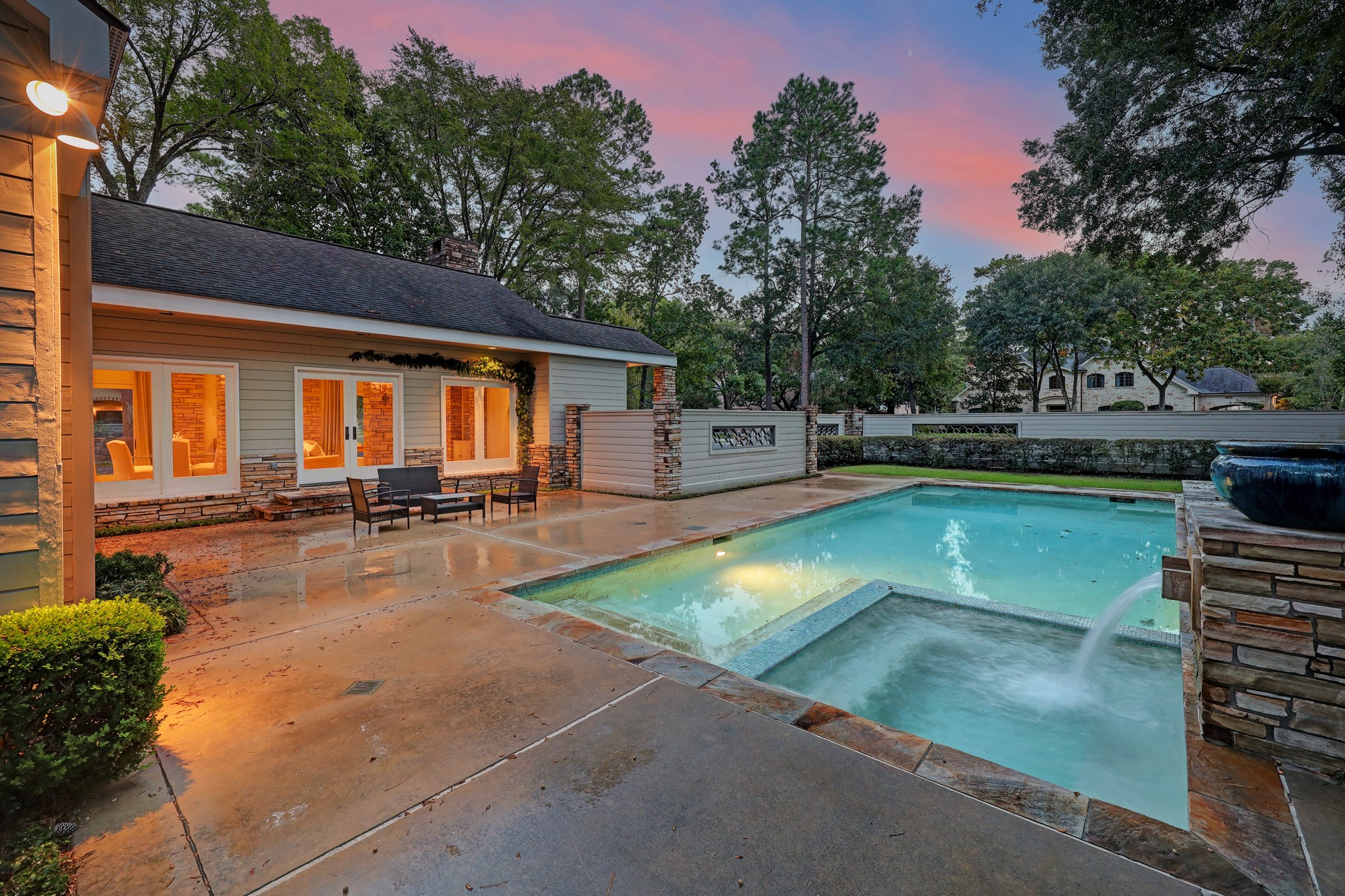 View of the large pool and attached spa and spacious outdoor patio space