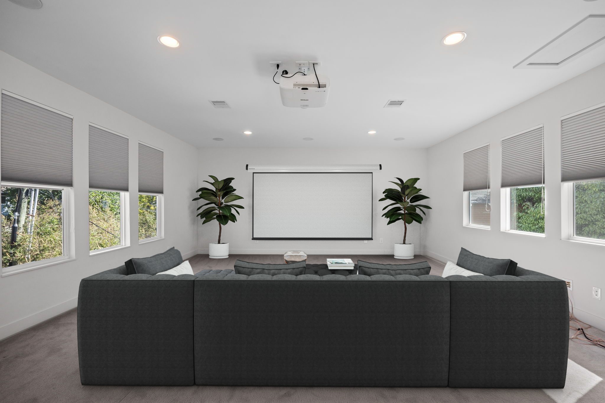 The other side of the room features an included projector and could be used as a movie room.