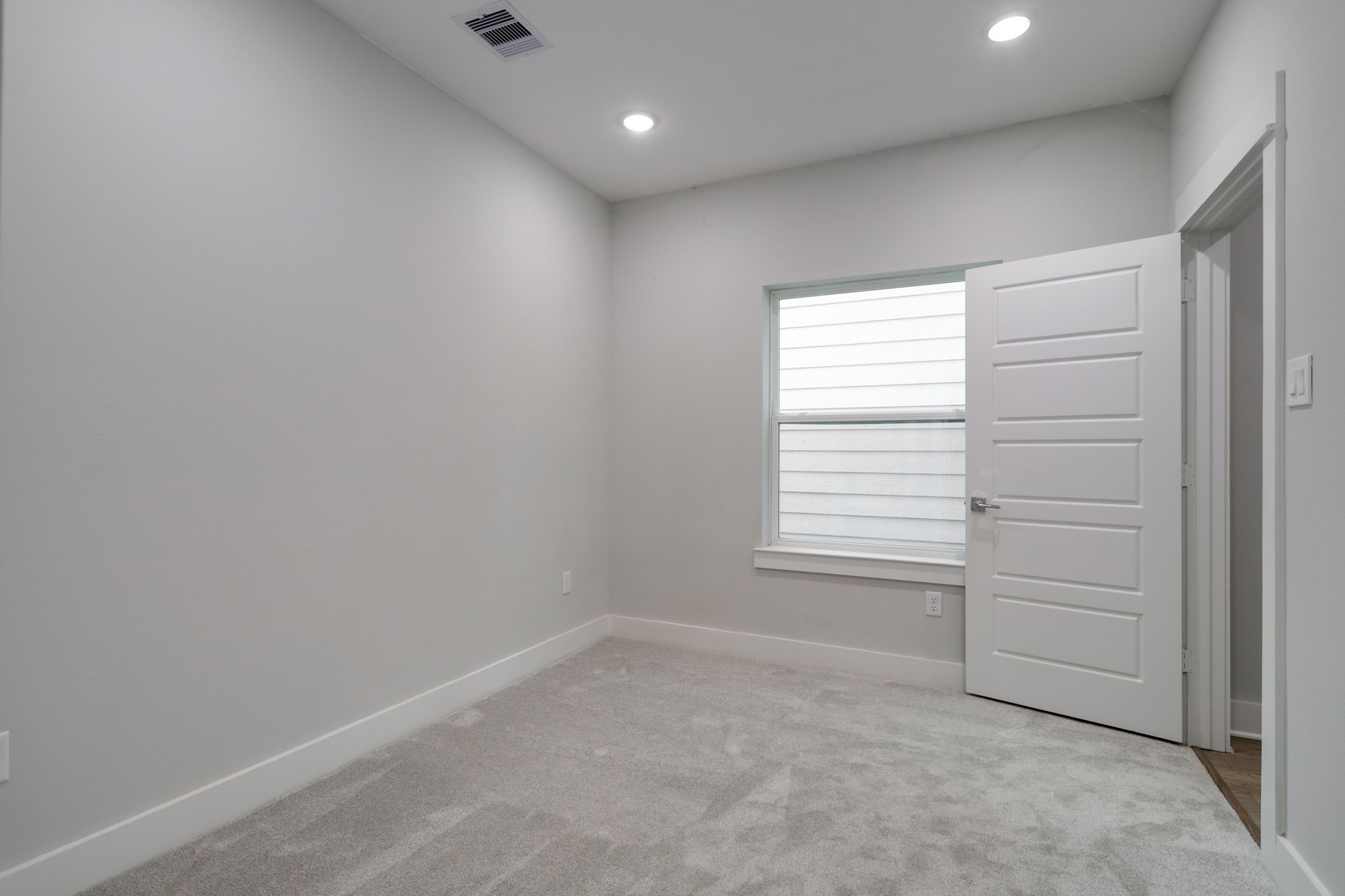 This secondary bedroom can serves as a guest bedroom with its convenient location on the first floor.