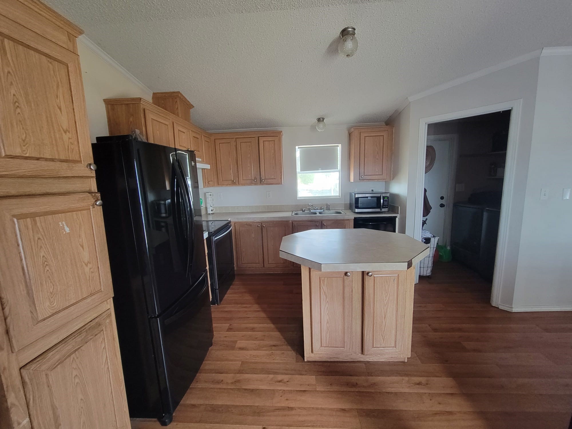 Open concept Kitchen with the laundry room conveniently located next to it!