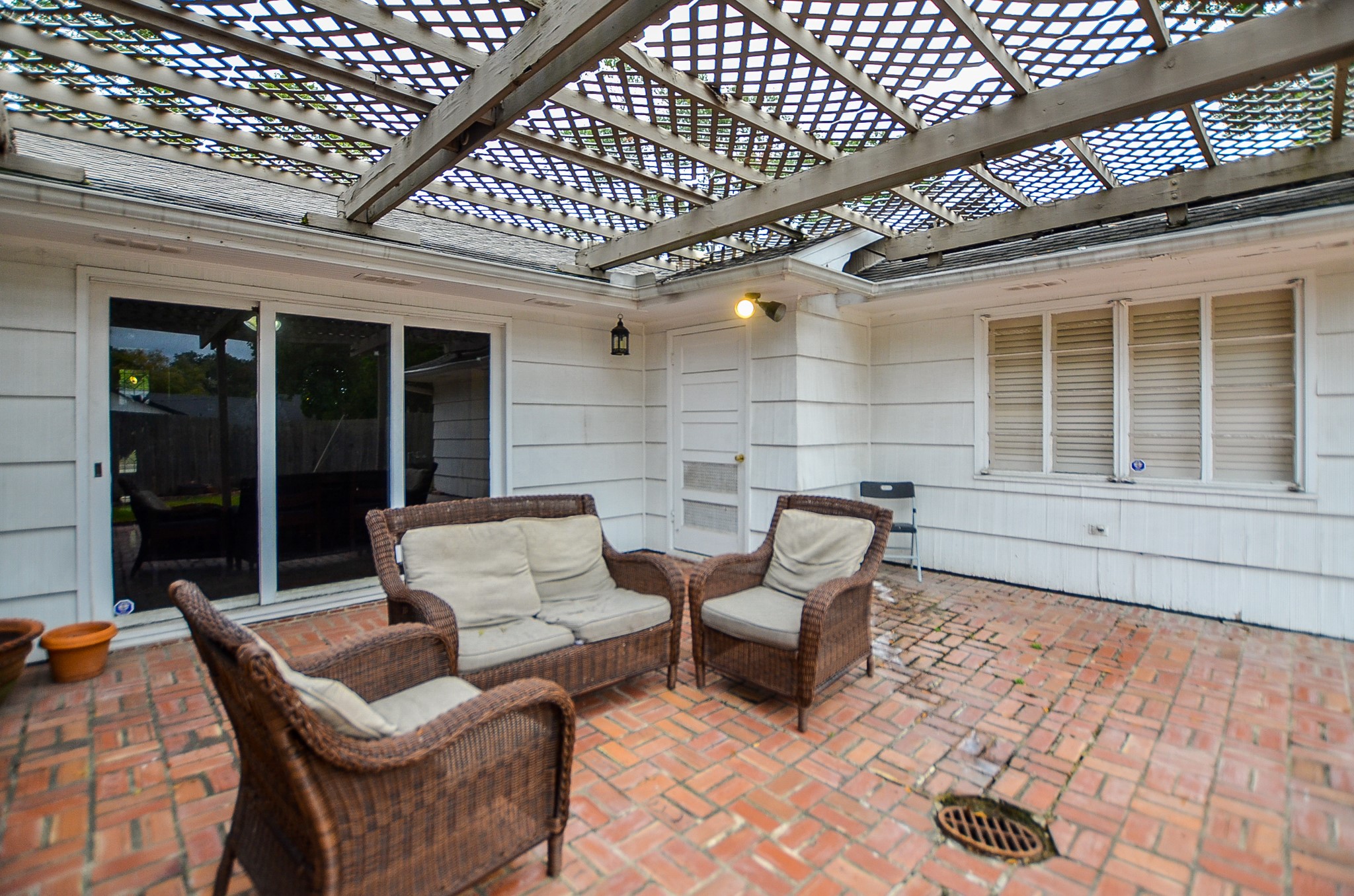 Your spacious covered patio embraces brick paved floor and gorgeous pergola accents, above!