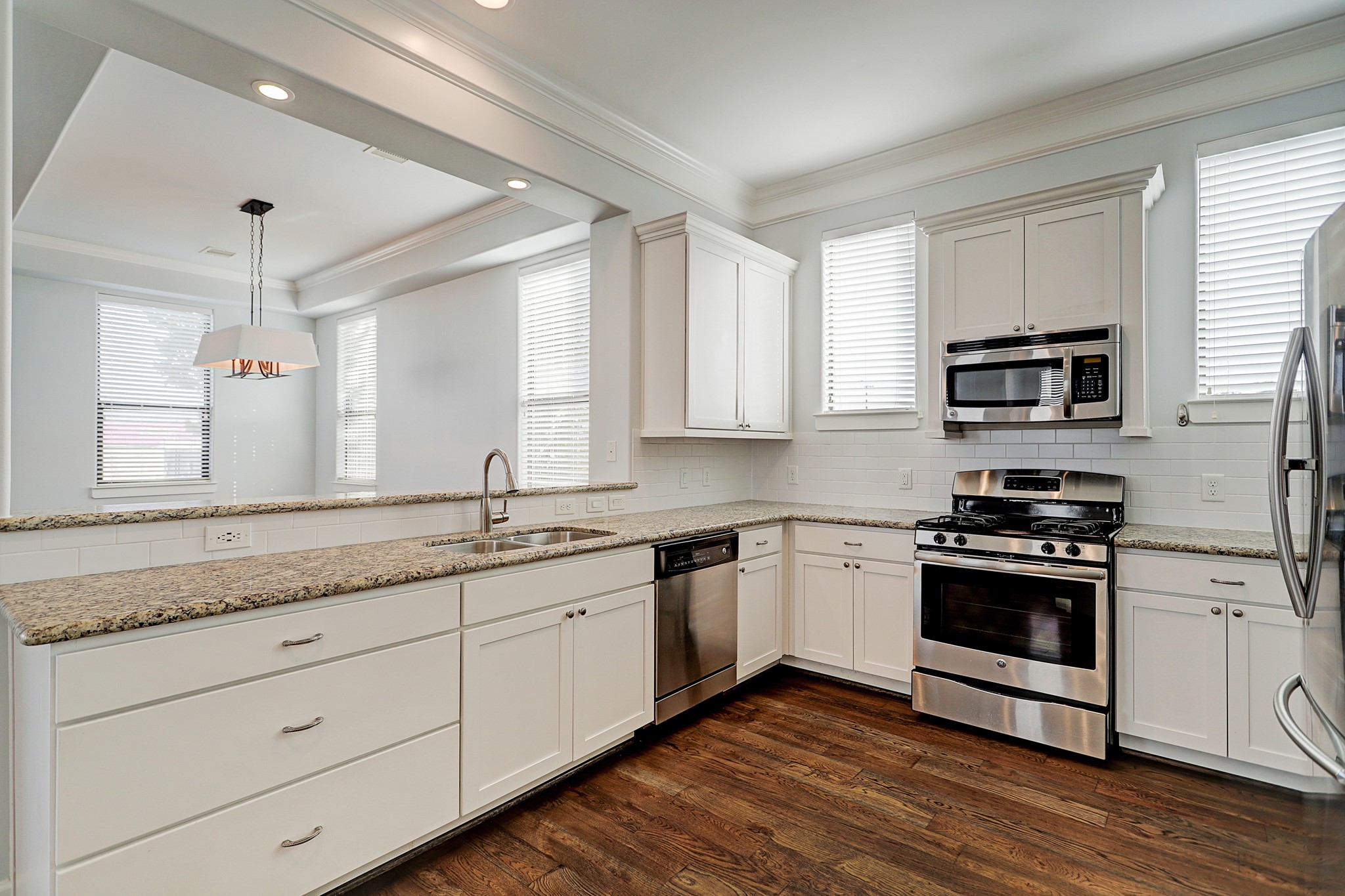 Amenities worth noting in the kitchen include granite counters with stainless appliances.