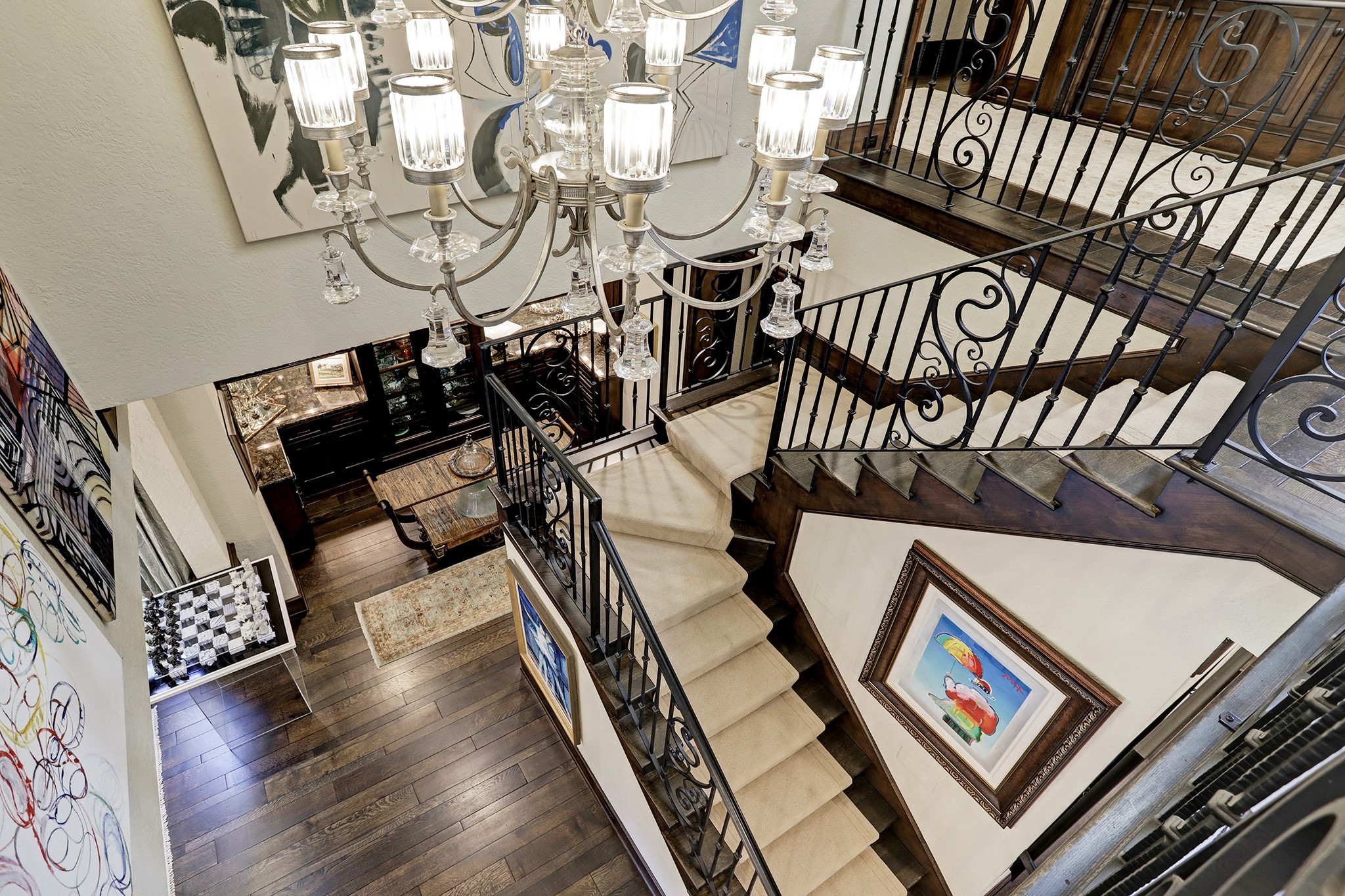Architecturally Impressive Staircase Highlights the Center of the Home.