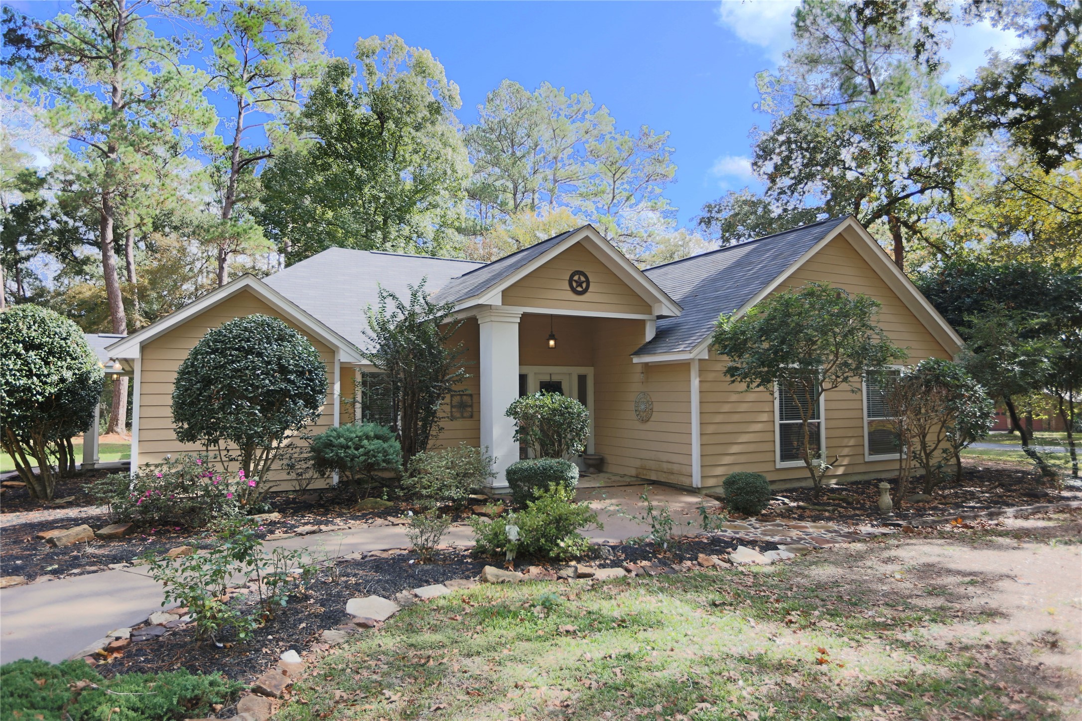 Welcome home!  Situated on almost an acre, with no deed restrictions, just outside of Magnolia.  Take a look!