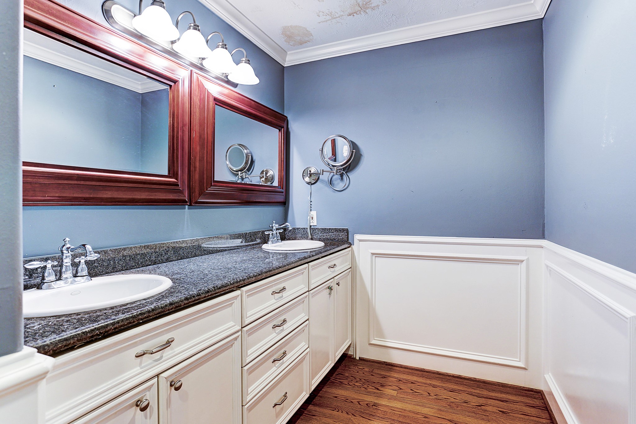 Double sinks and built-ins dress up the primary bathroom.