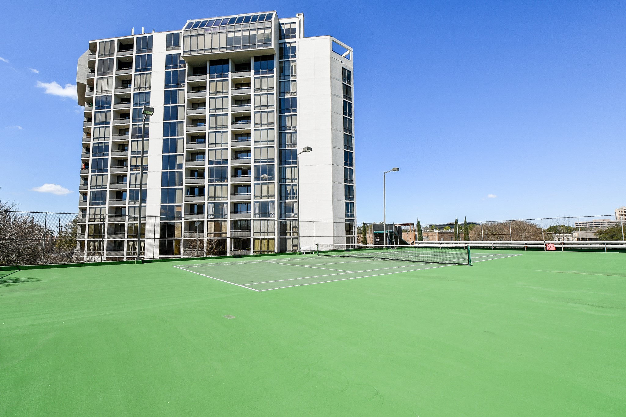 Located above the parking garage are tennis & basketball courts.