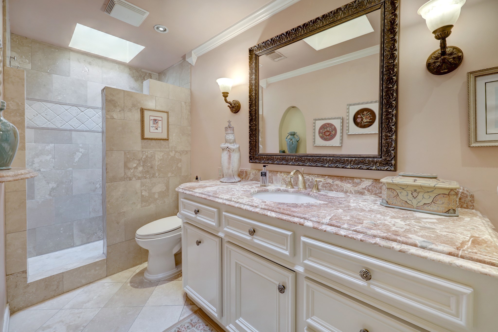 PRIMARY BATHROOM is a beautiful en-suite with granite counter and oversized walk-in shower.