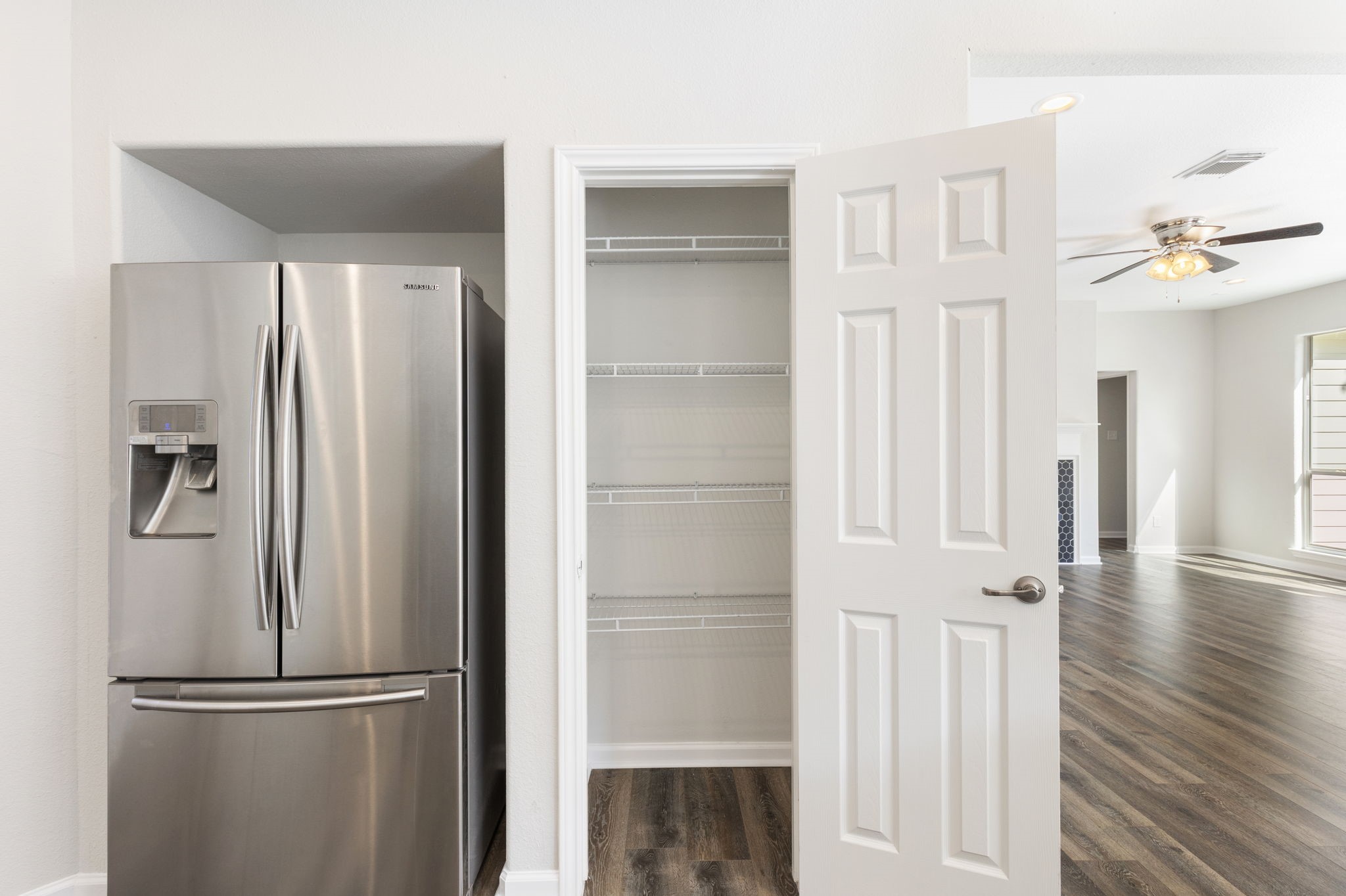 The kitchen has a pantry and double door Samsung refrigerator with water/ice dispenser that is included with the purchase of the home.