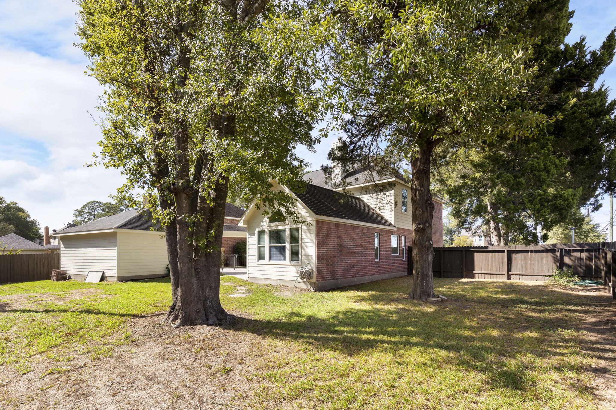Enjoy the mature trees and large backyard!