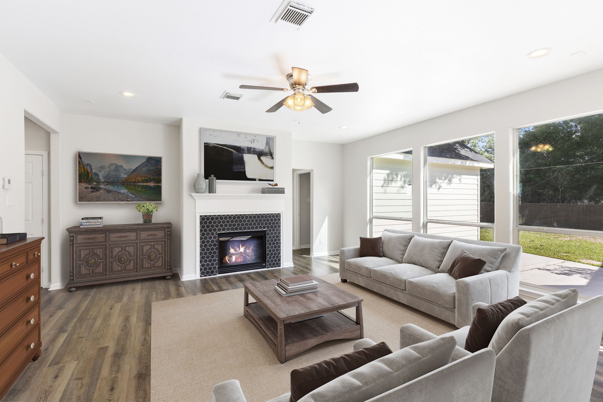 This home has a spacious family room with a wall of windows to the backyard allowing tons of natural light to pour into the home.   Enjoy the gas log fireplace with contemporary tile backsplash and wood mantle.  **This image has been virtually staged