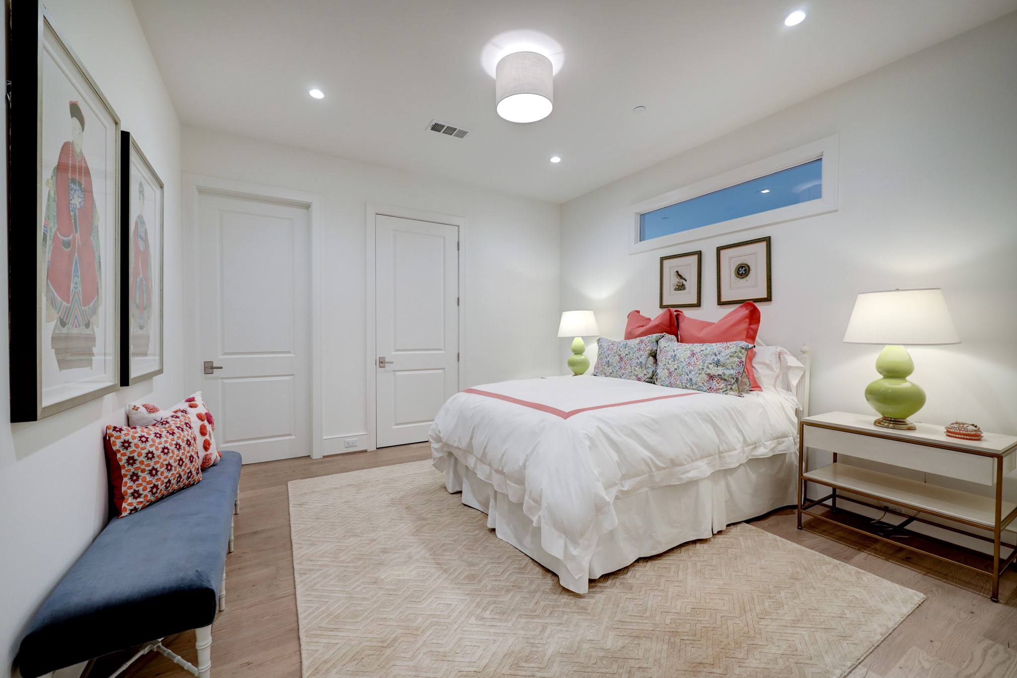 One of three GUEST BEDROOMS - this one (16 X 11) is located just off the Front Hallway and includes hardwood flooring, recessed lighting with central light fixture, walk-in closet with built-in shelving, raised ceiling, 2 windows, shared en suite bath with Guest Bedroom #2.