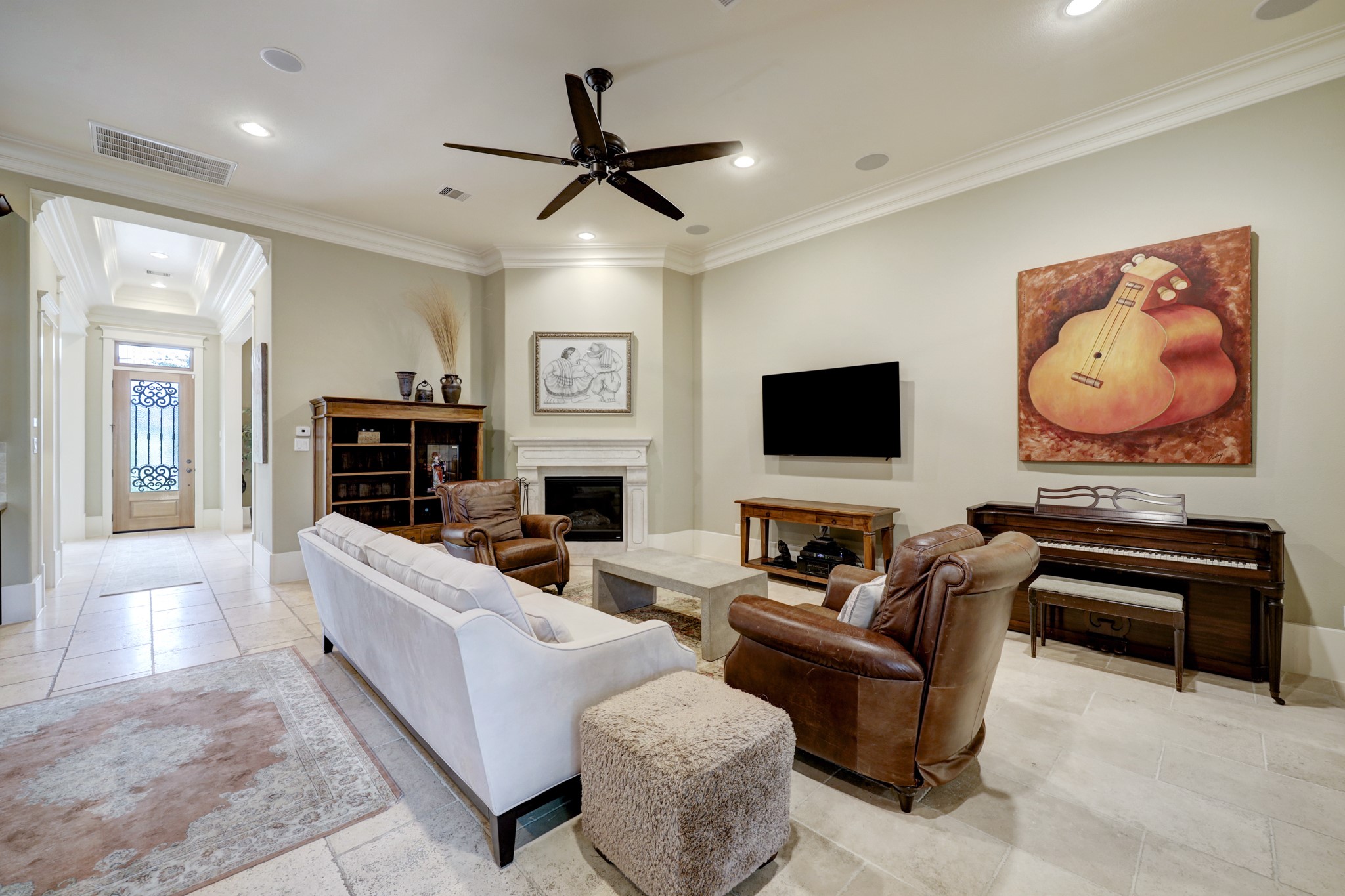 The family room has a gas log fireplace and adjoins the gourmet kitchen.  Fully wired for sound through the Control 4 system.
