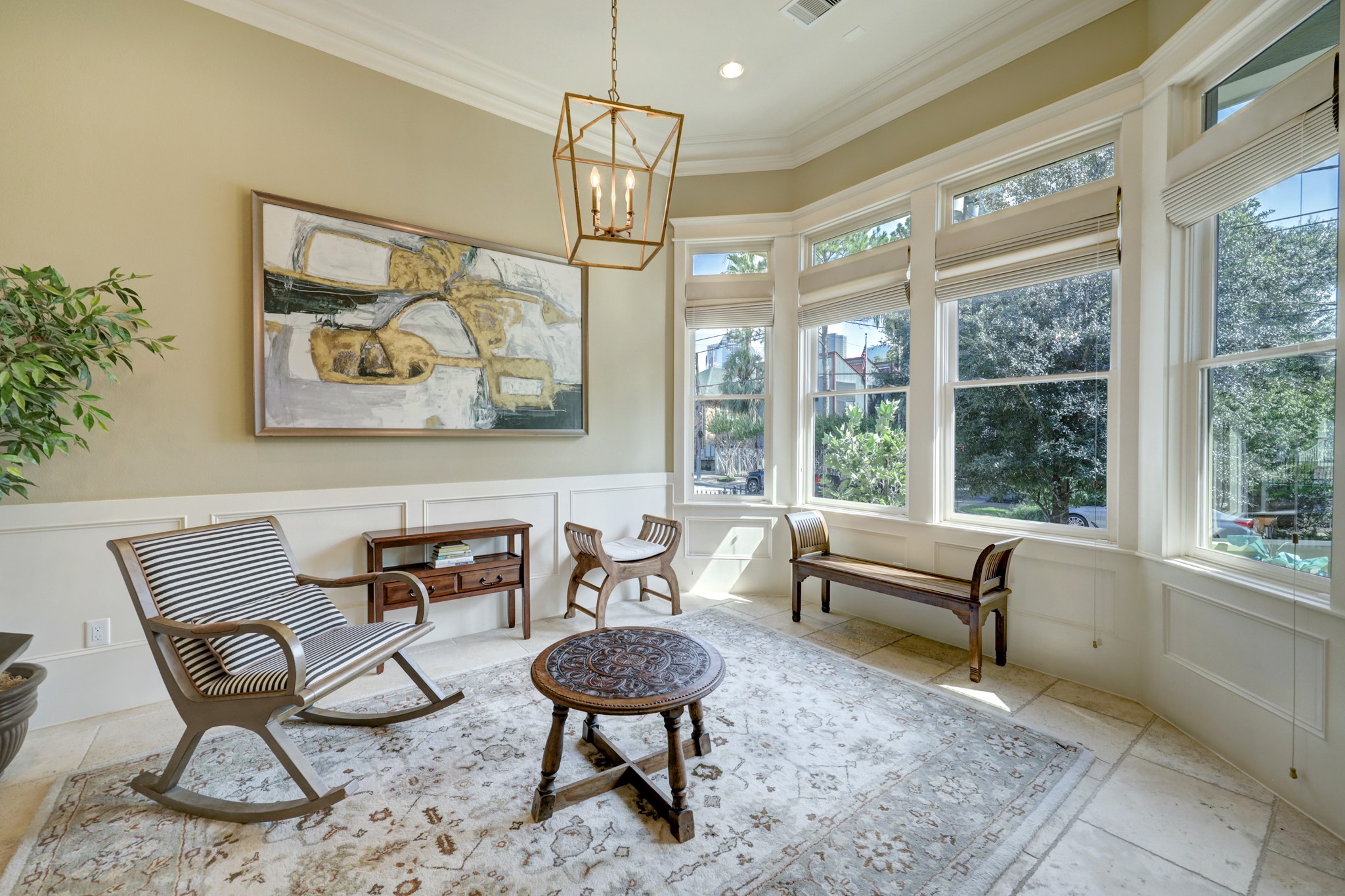 The dining room features Crown molding, chair railing, Victorian custom extra large Jeld-Wen low-e windows, custom window shades and 12' ceilings.