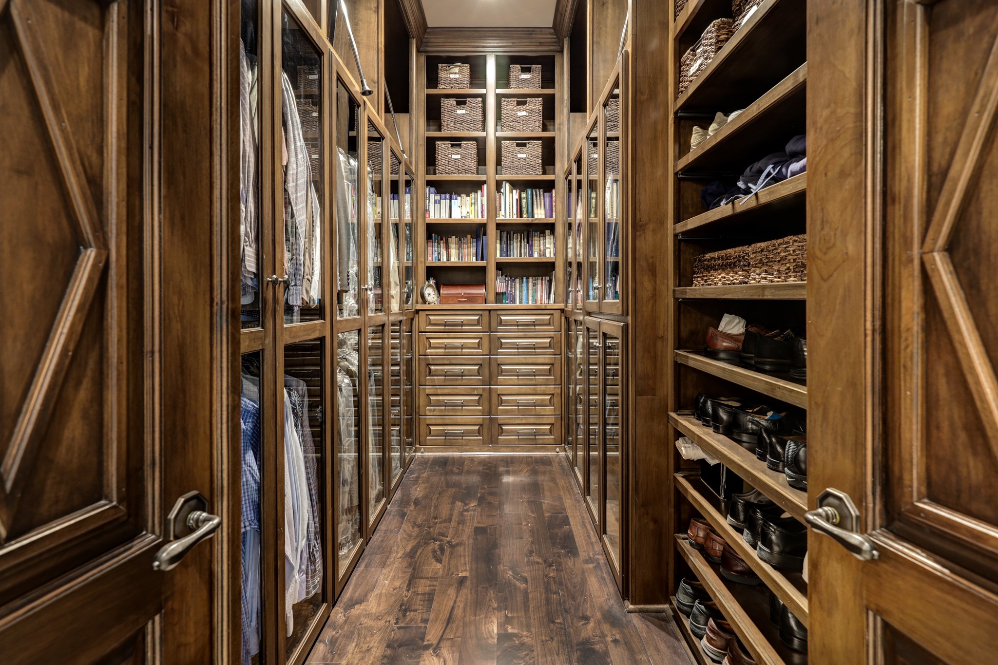 Second primary walk in closet with custom cabinetry and drawers