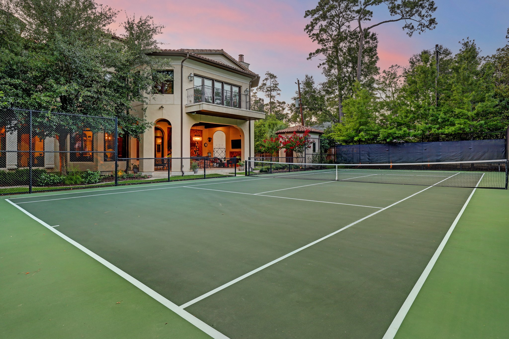 One of the many luxuries this home has to offer is its very own private hard topped tennis court