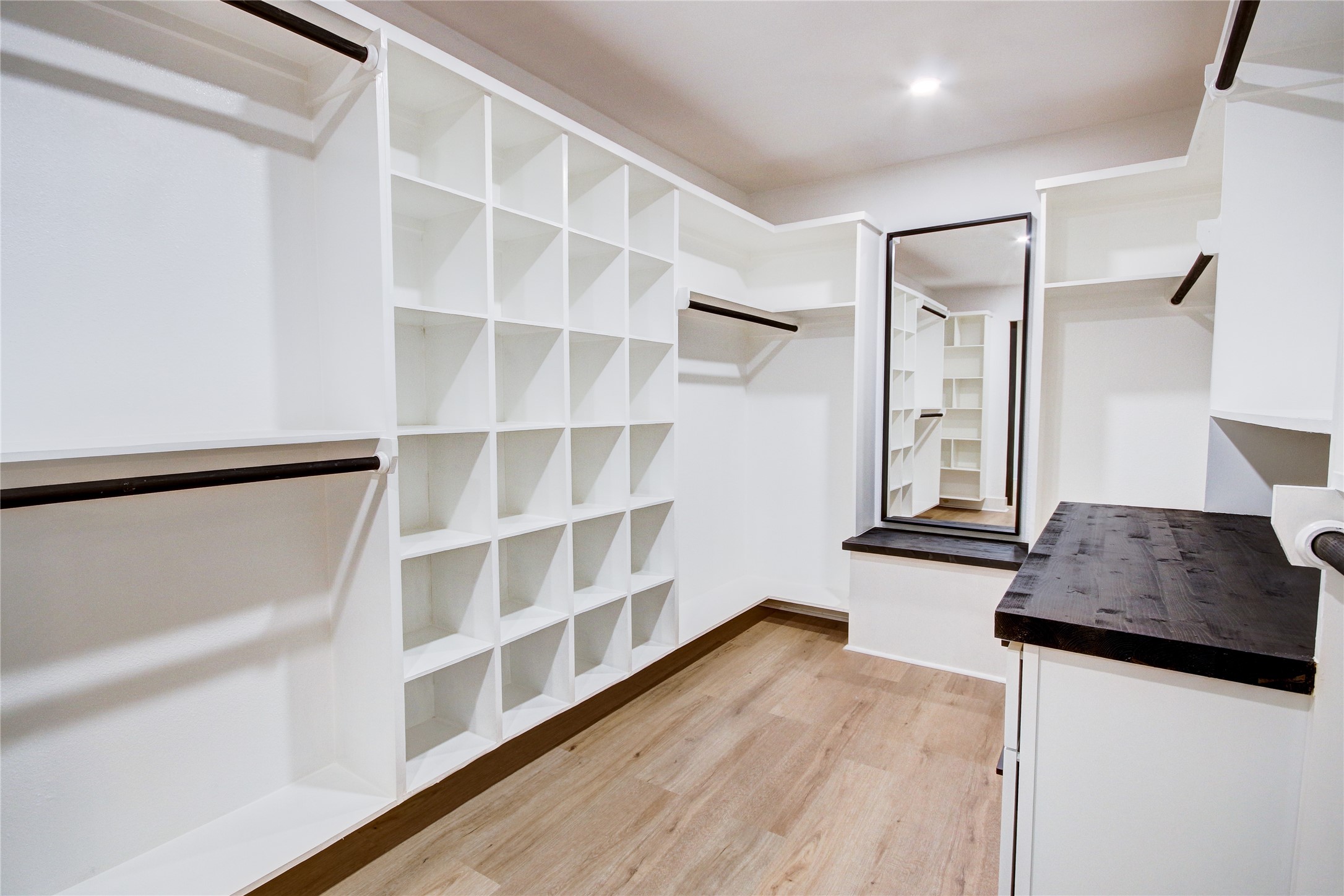 Ample storage and custom built-ins with full body mirror!