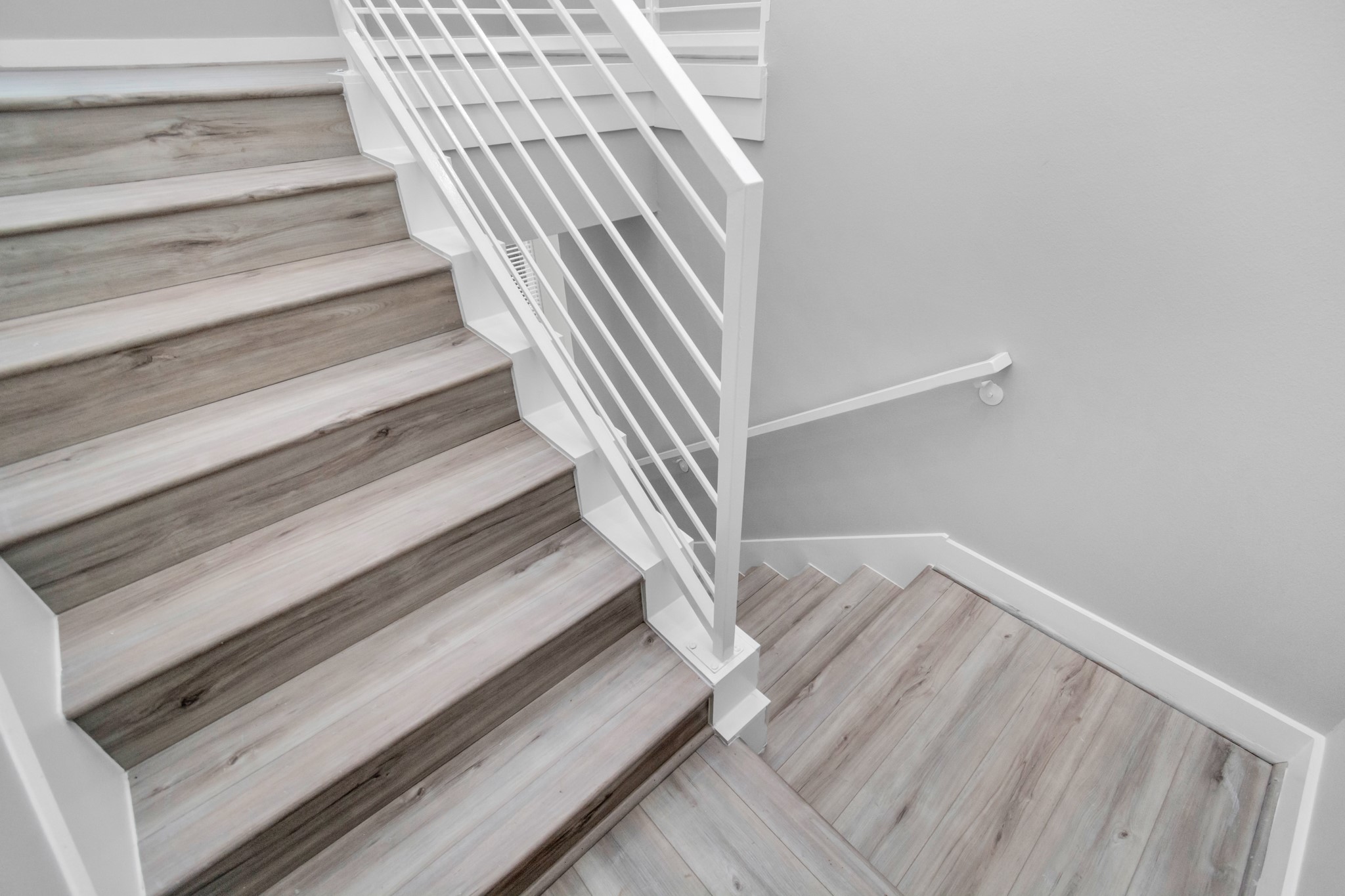 Heading upstairs, you will find the LVP Flooring flows up the stairs and onto the secondary floor.