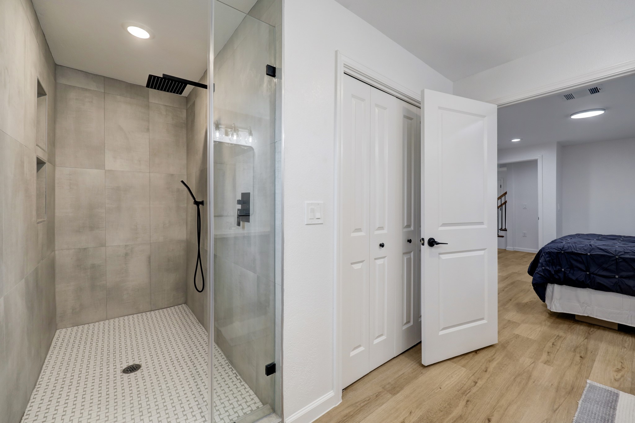 Step inside the HUGE primary shower that has two niches and a hand held wand.