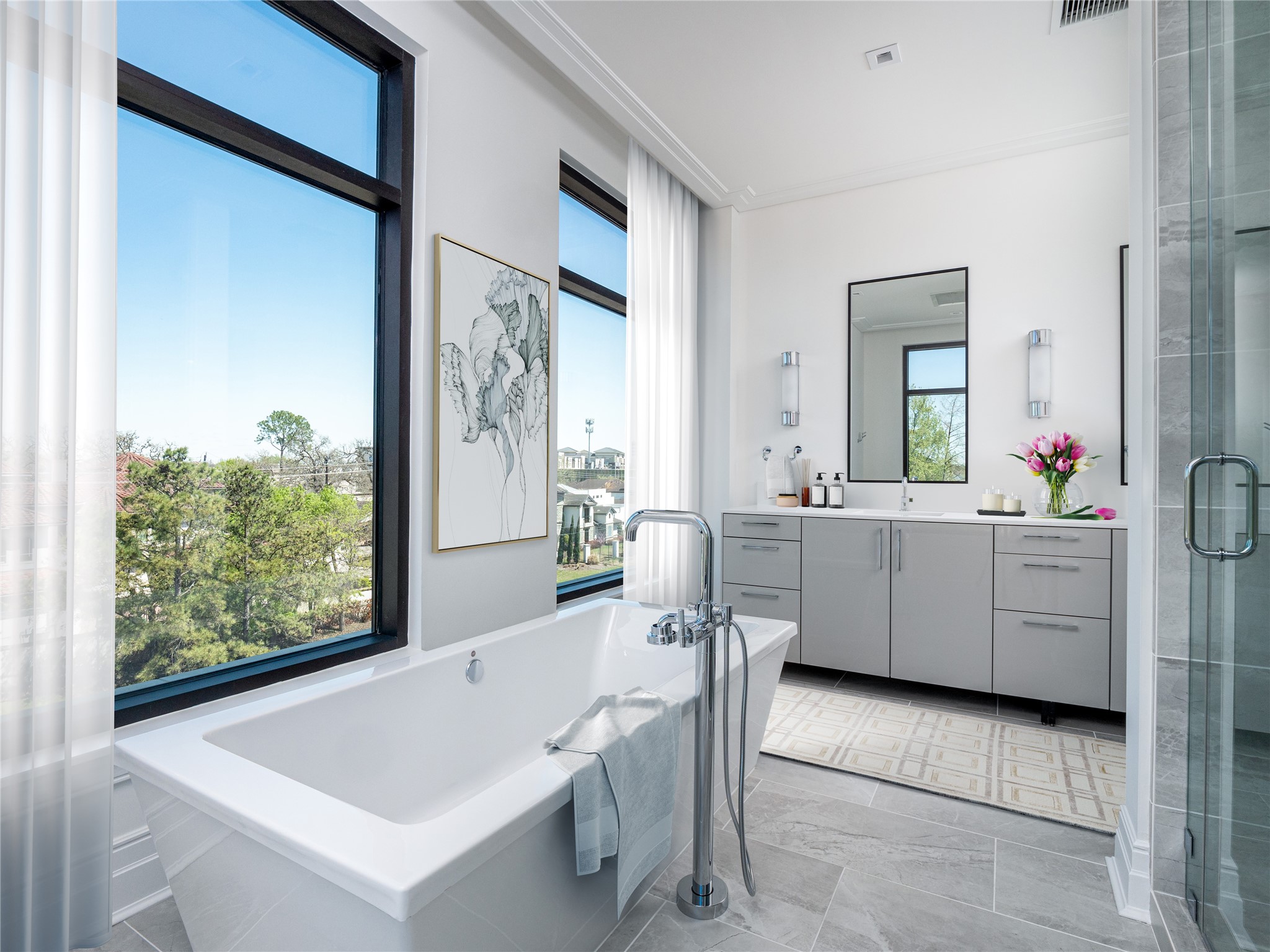 At the end of the day, come home to this sleek and relaxing free-standing designer soaking tub with incredible views.