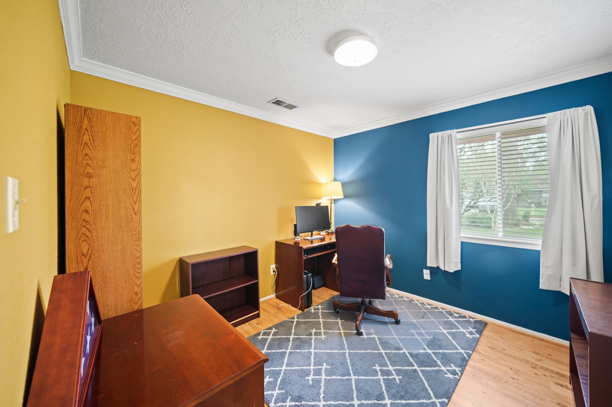 Your guests will rest comfortably in either of the spacious secondary bedrooms. This bedroom has designer paint, fantastic natural light and plenty of room for furniture, toys, games, etc.