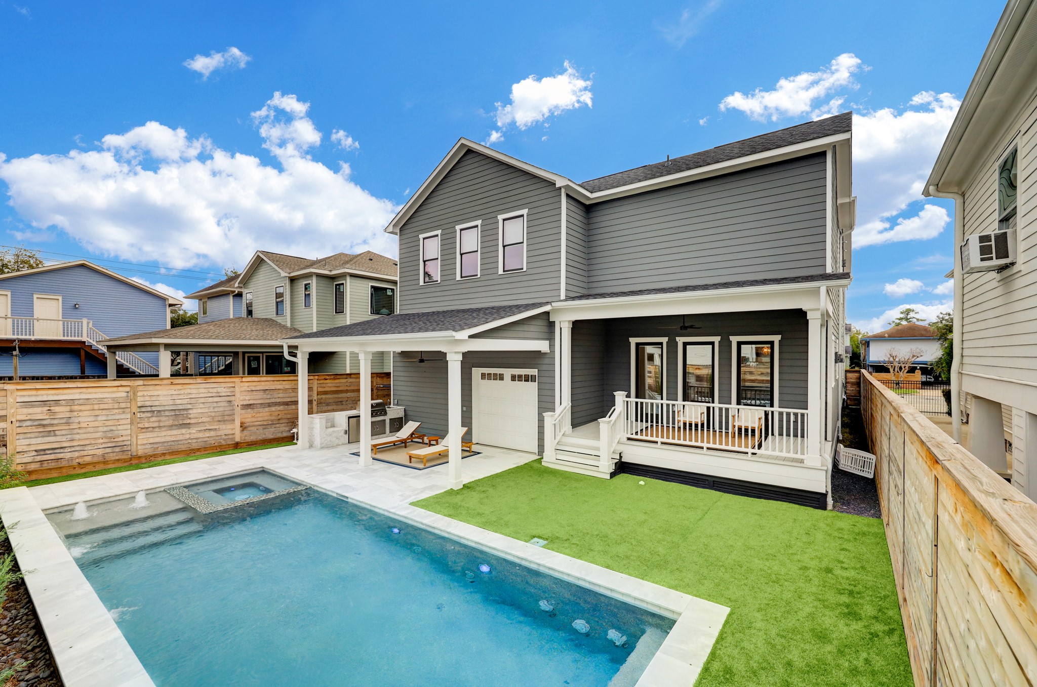 The 35-foot by 14-foot sparking swimming pool beckons with water features and an extra-large spa. Complete outdoor kitchen and second garage door provides additional arrangements and convenience for parties and gatherings.