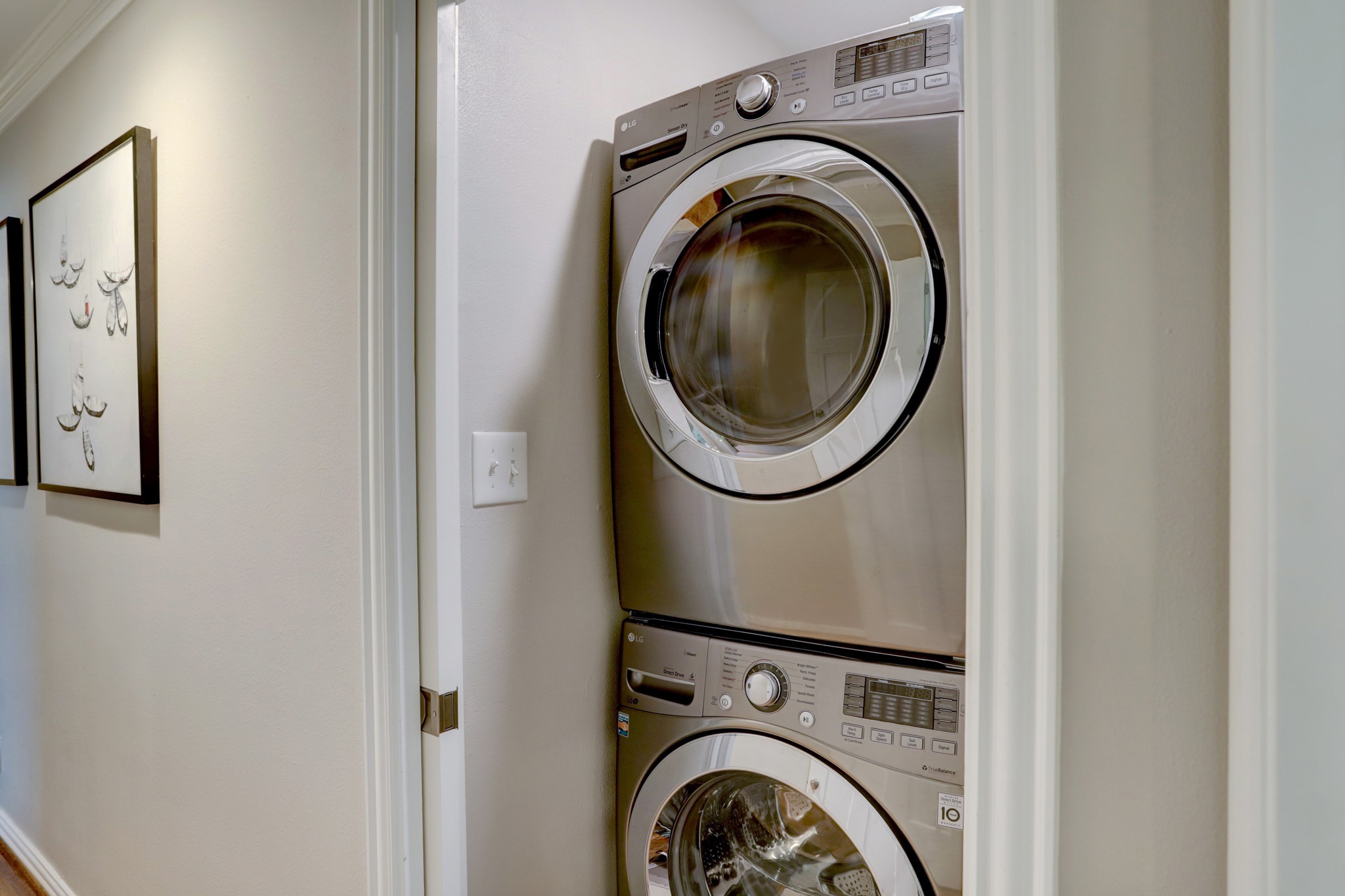 Laundry area conveniently located in hallway with 3 additional bedrooms.