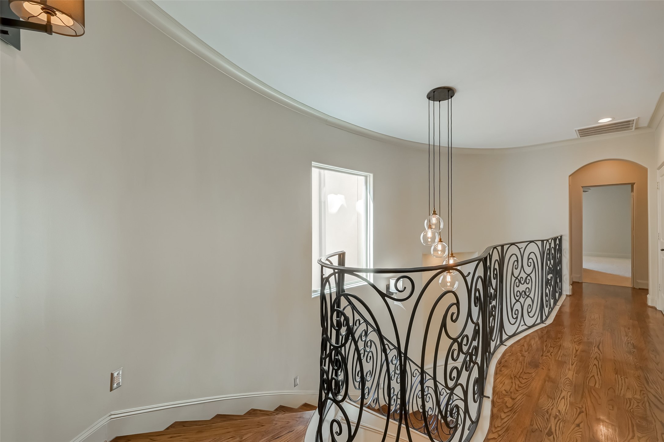 Second floor hall showing beautiful hardwoods and​​‌​​​​‌​​‌‌​‌‌​​​‌‌​‌​‌​‌​​​‌​​ railing.