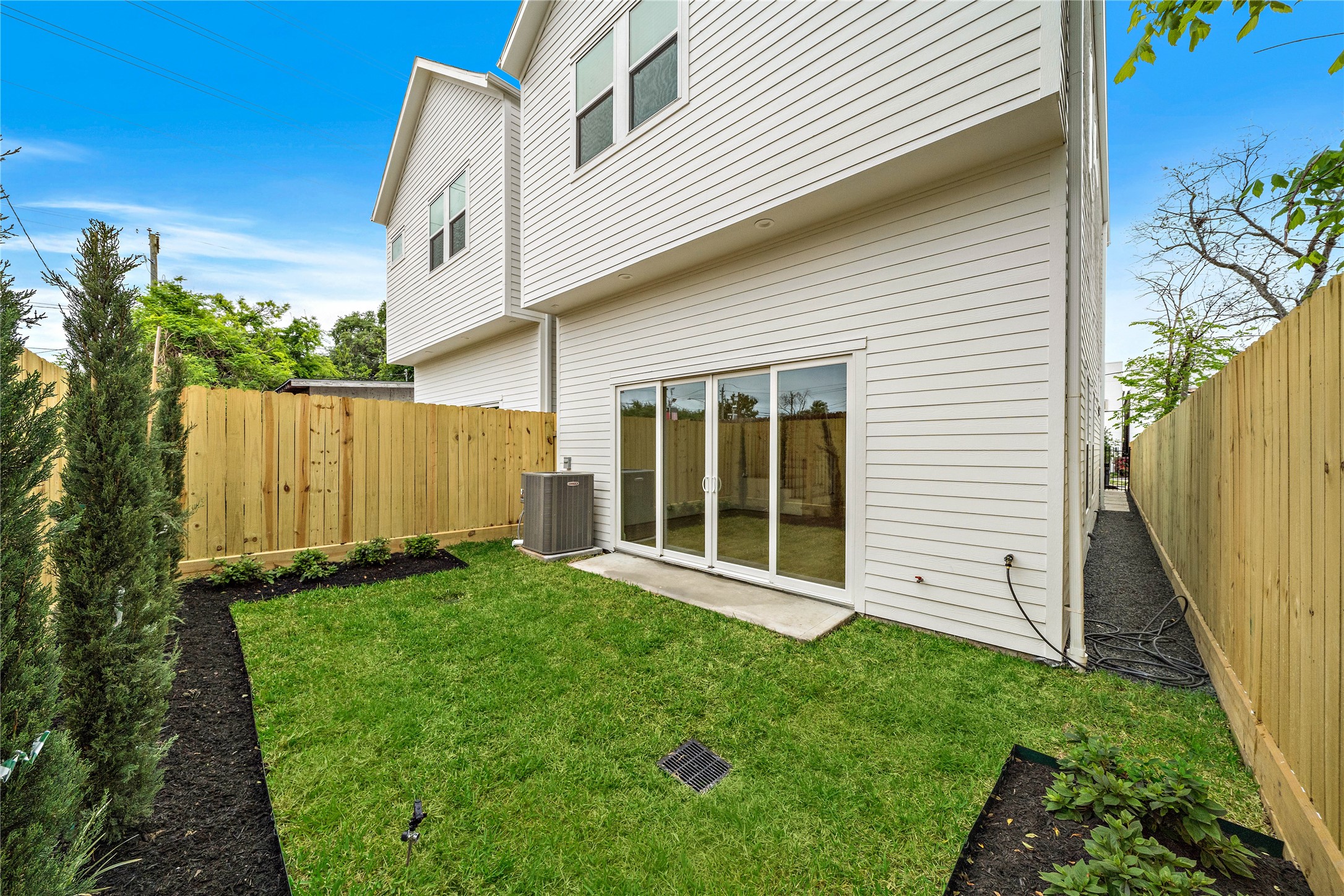 Large private backyard, perfect for entertaining! (Yard features upgraded landscape package.)