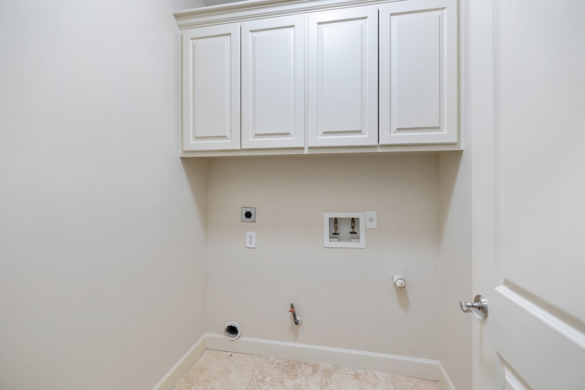Walk-in utility room with extra storage in on the third floor.