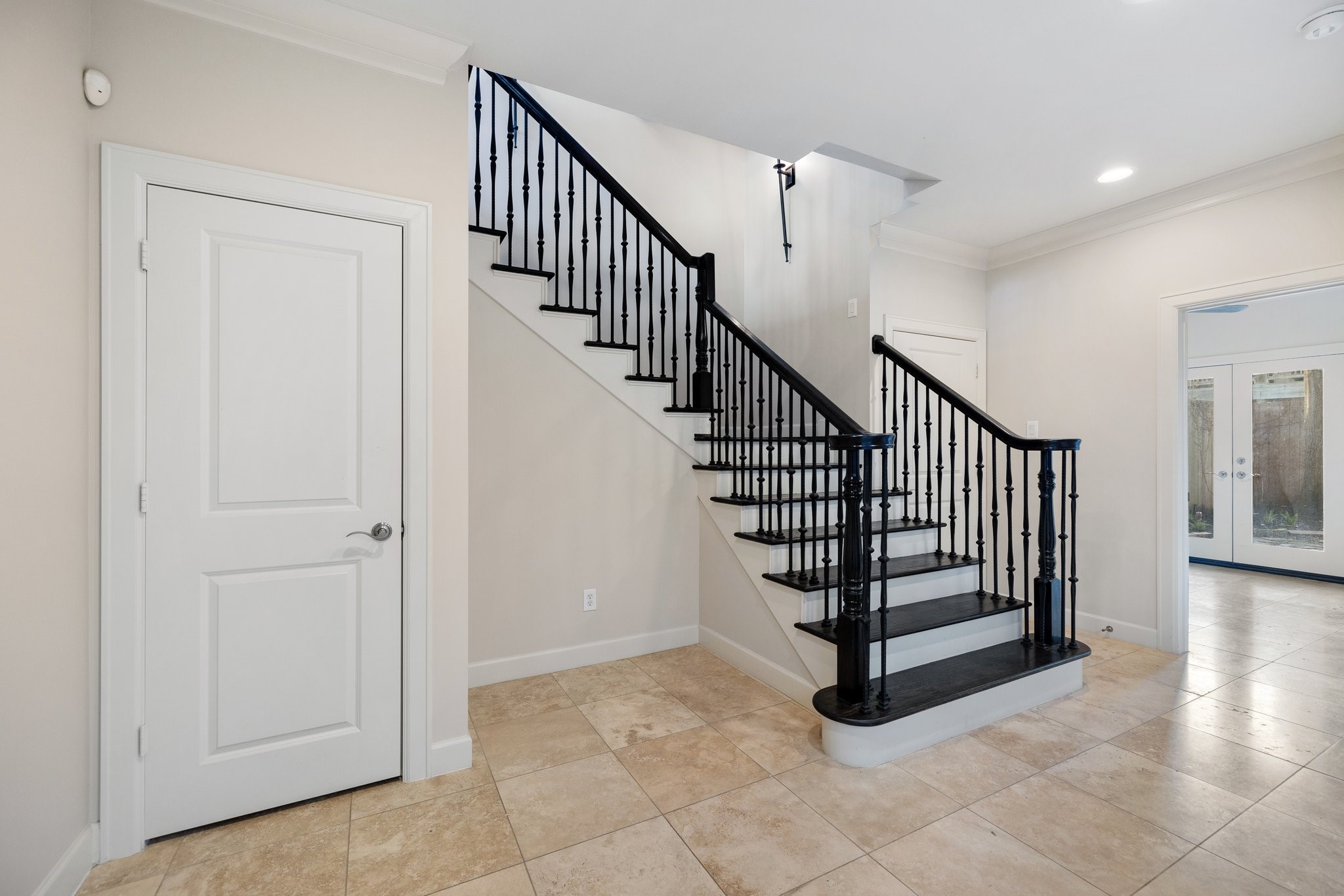 Enter into your foyer on the first floor which features an en suite bedroom that could also be an office.