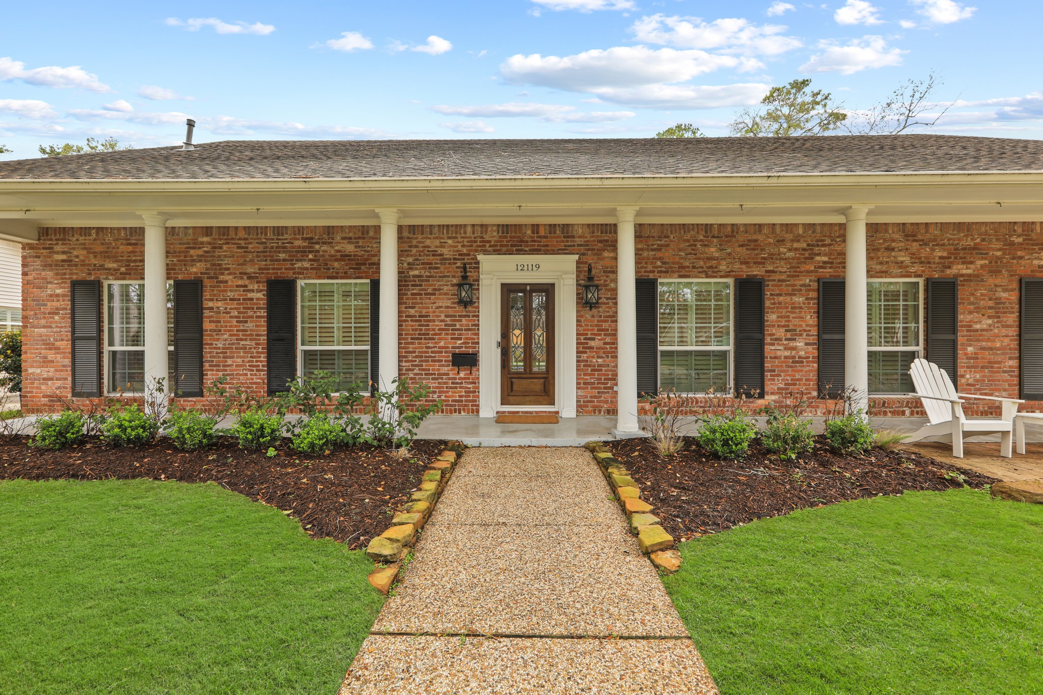 Sophisticated traditional home with inviting curb appeal.
