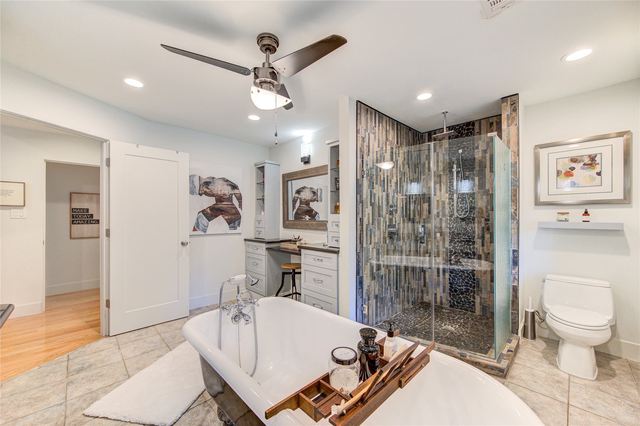 In addition to a freestanding tub, there is a walk-in shower with a rain shower and frameless glass.