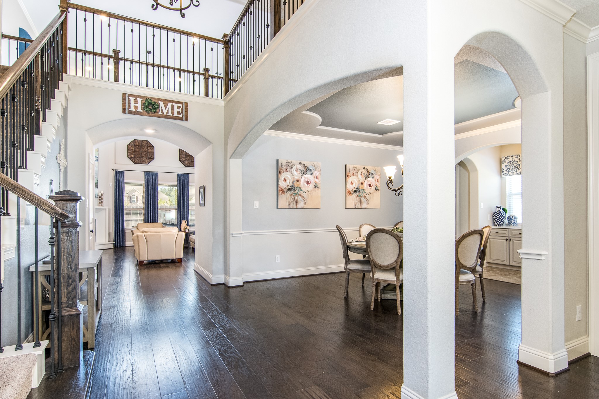 Dramatic entry with 20 foot ceilings, wrought iron staircase.  Elegant 6 3/8