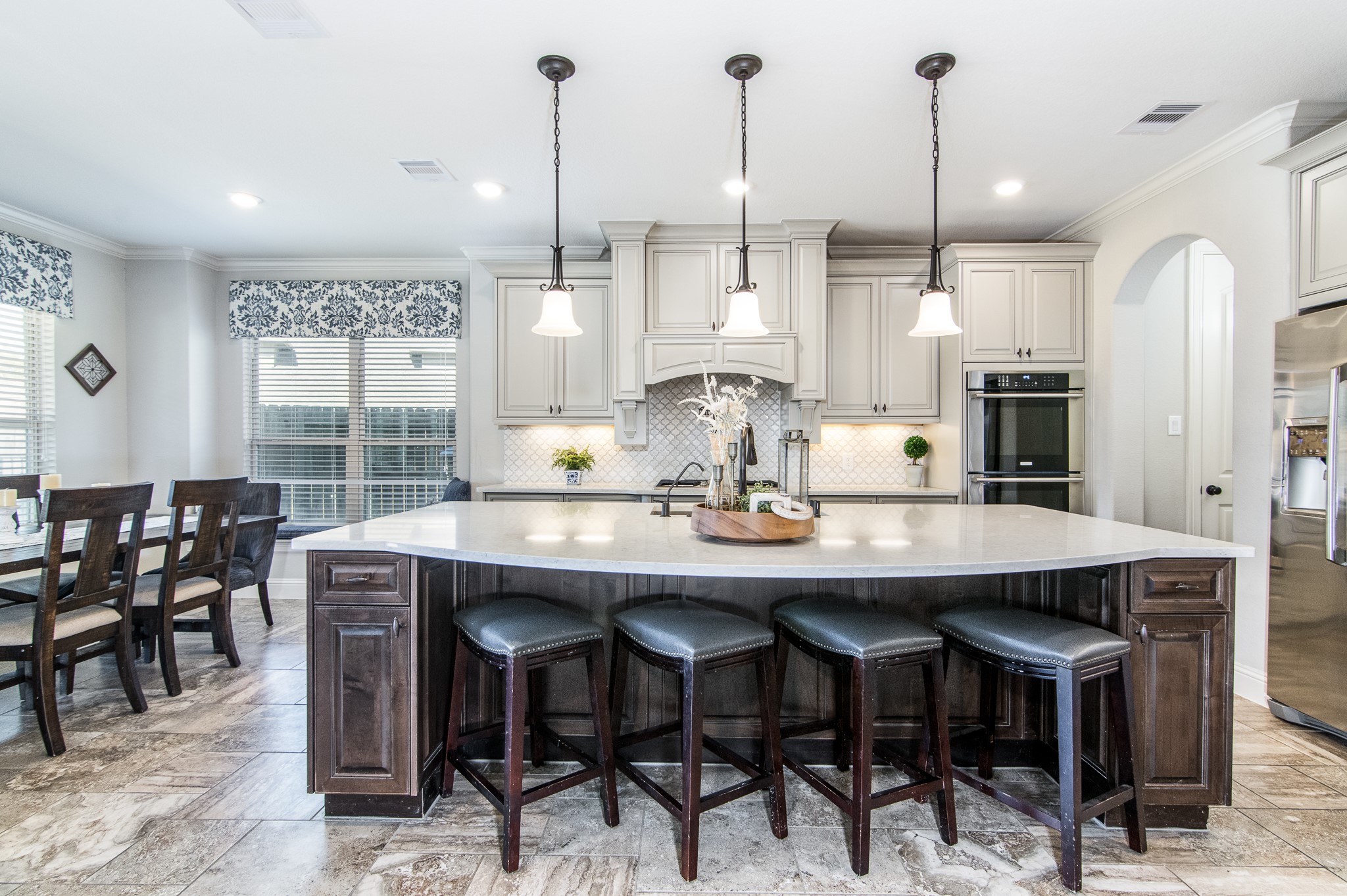 Gourmet Island Kitchen w/ Amazing Glazed Cabinets, Customized window treatments and Granite Countertops with upgraded appliances! 42 inch cabinets with endless storage.  Huge island with bar top seating.