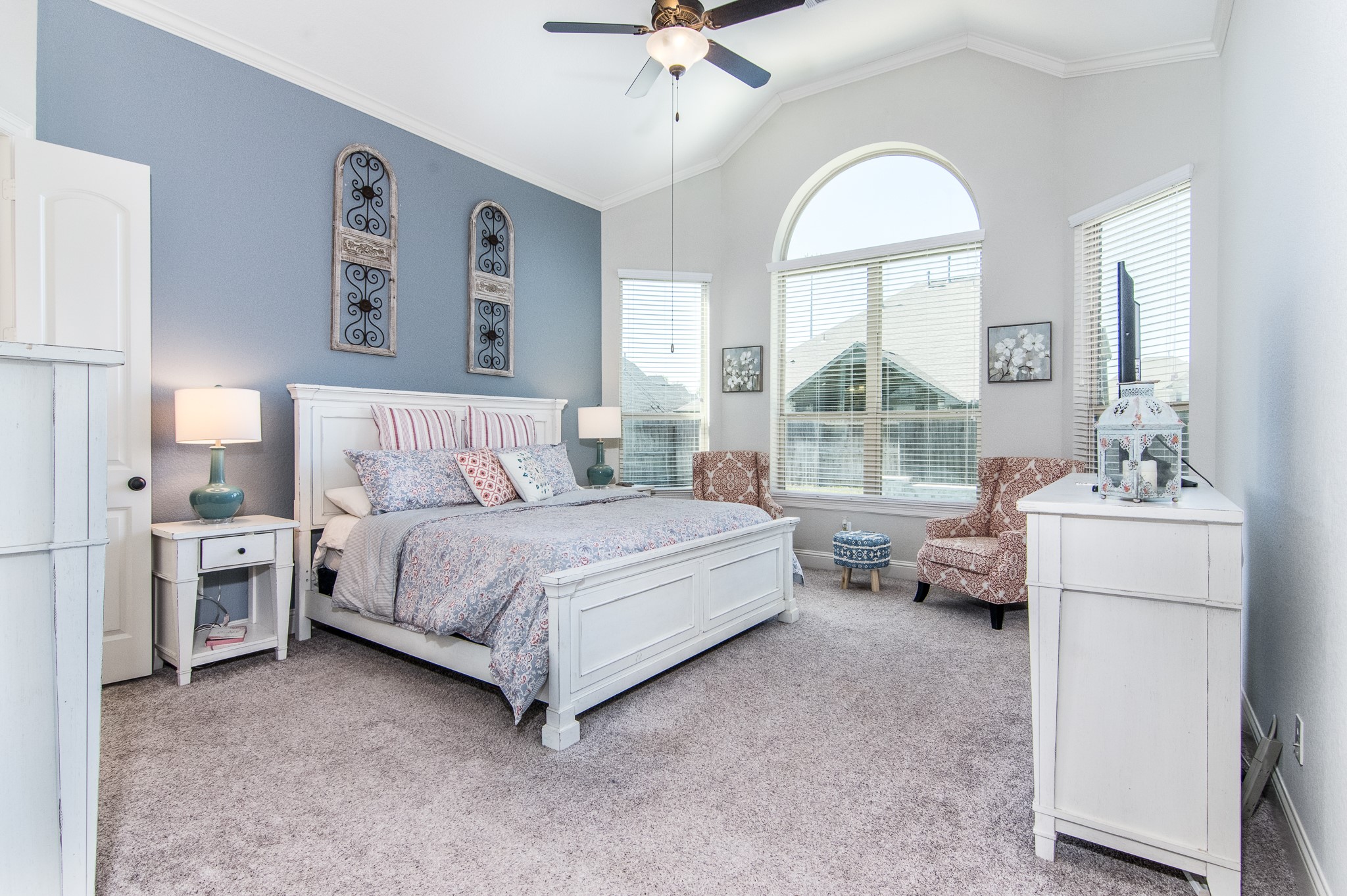 Master Bedroom with tall ceilings, Large windows, Natural light, large his and hers walk-in closets, and 9 foot french doors.
