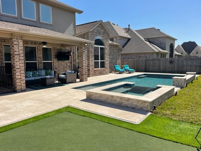 Enjoy your own professional putting green when you are not swimming.  Outside TV for entertaining.