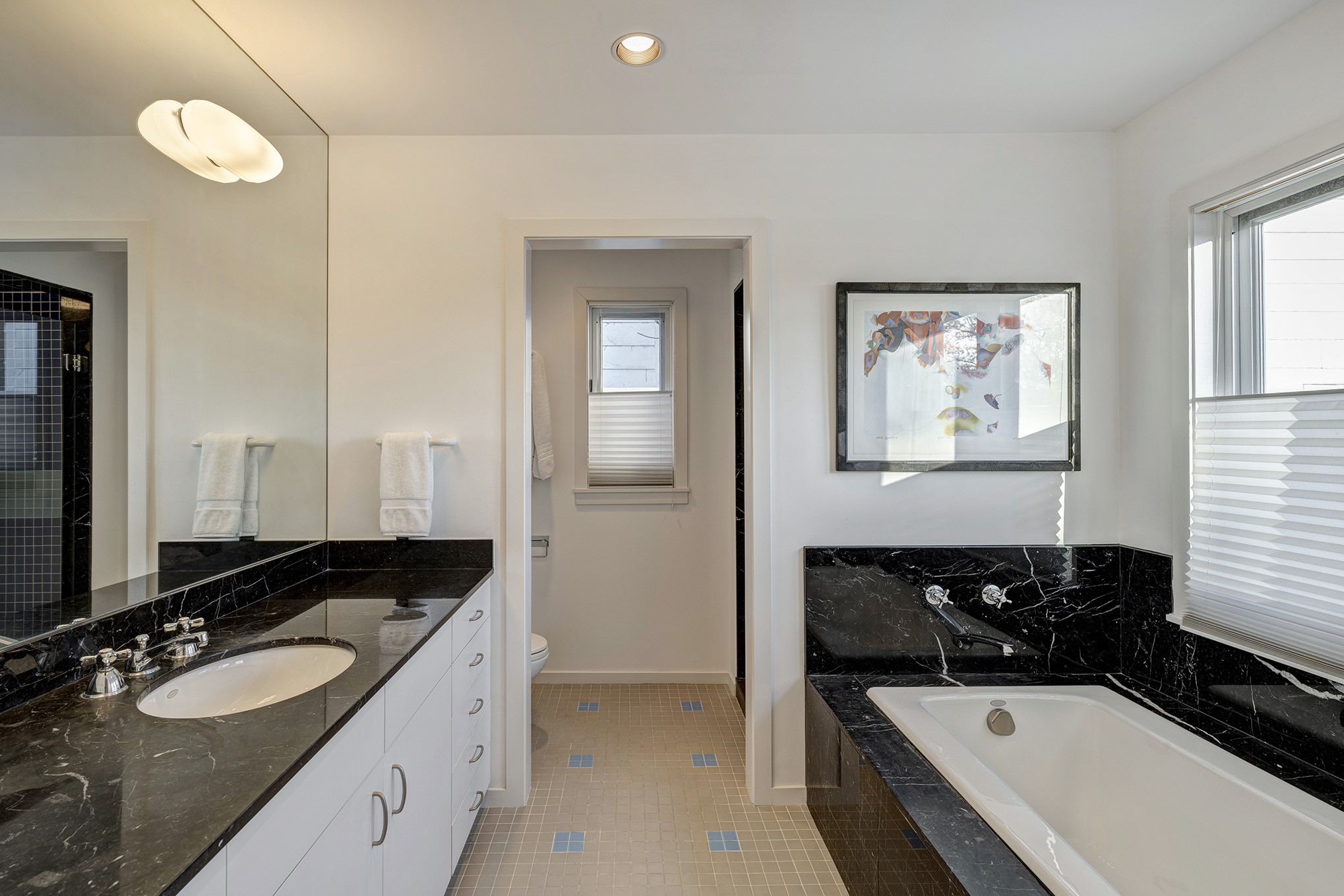 Primary bathroom boasts granite counter, soaking tub and separate walk-in shower.