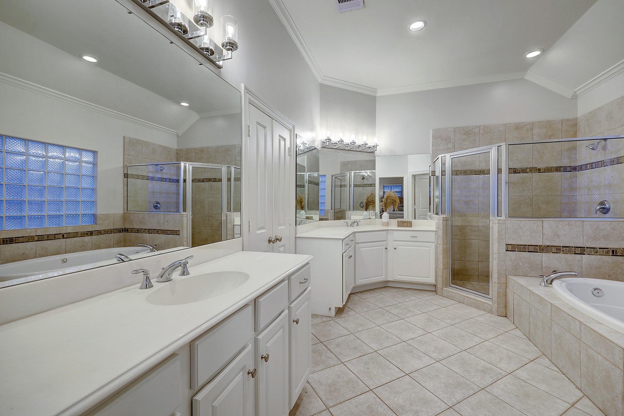 A spacious primary bath with double vanities.