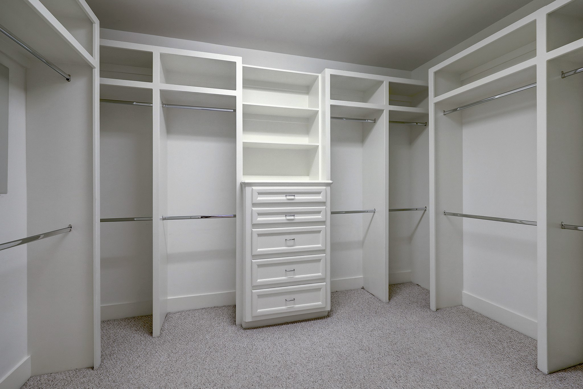 Huge primary closet with extensive shelving and great storage.
