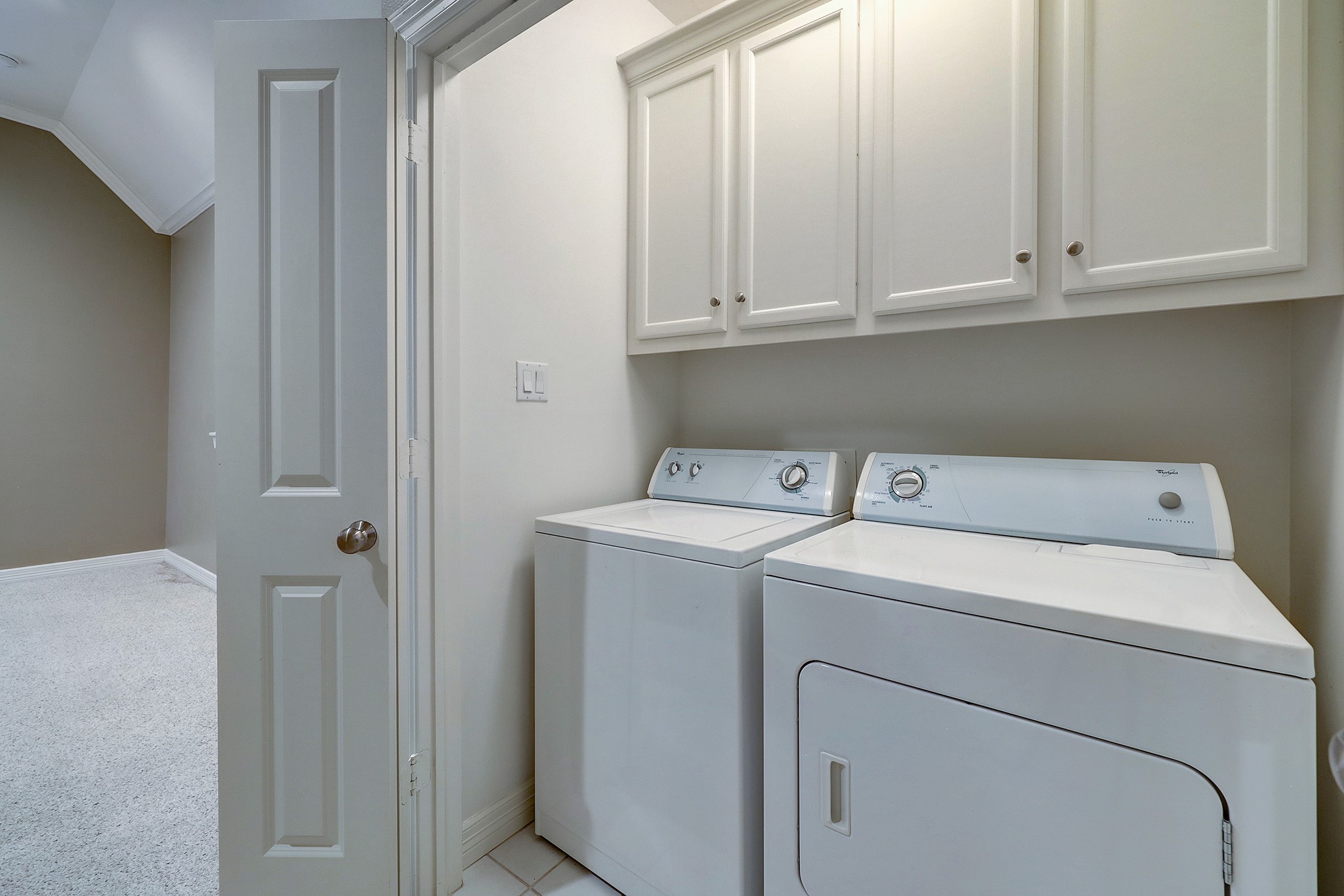 The laundry room is conveniently located on the third floor outside of the primary bedroom.