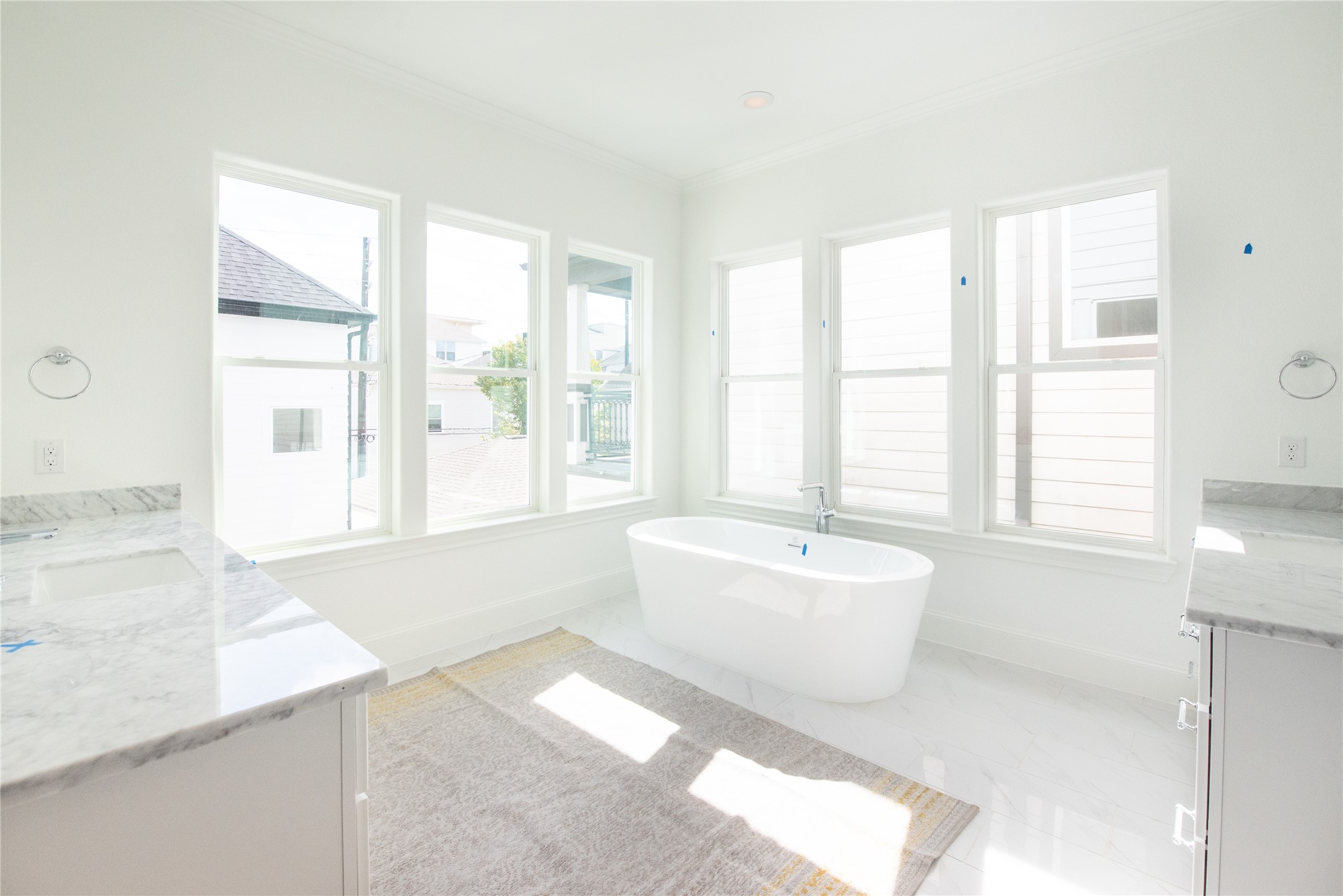 stunning bright primary bathroom with upgraded freestanding tub and tons of natural light similar to this bathroom