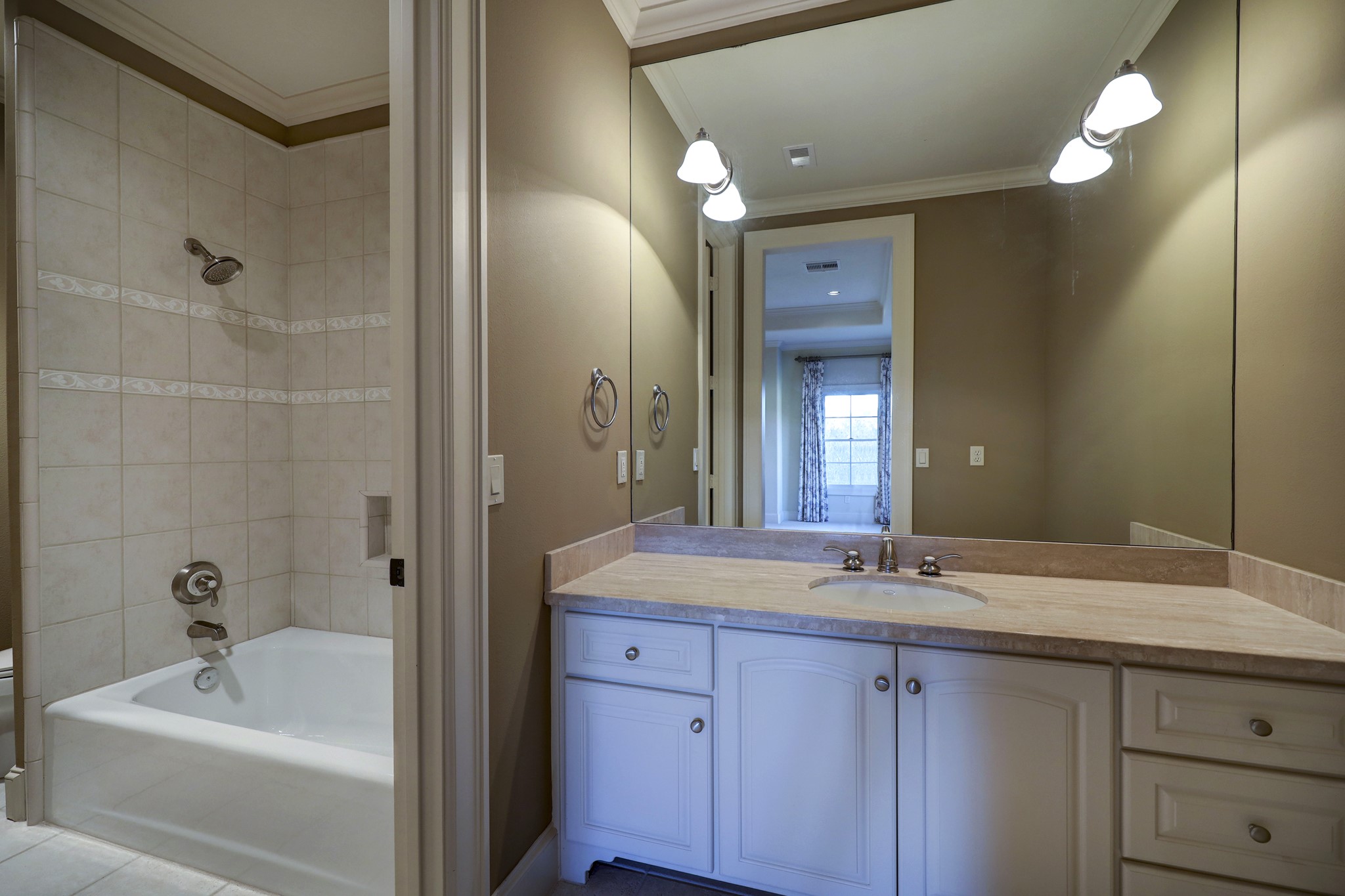 A convenient powder room serves the upstairs living spaces.