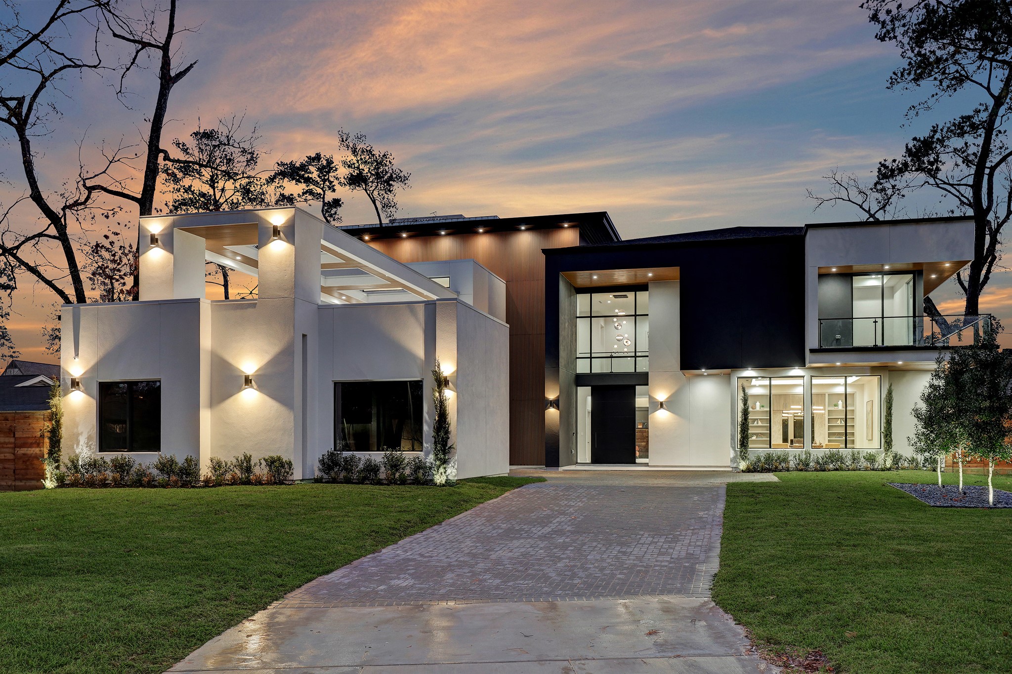 Extensive exterior lighting and manicured landscaping add exceptional curb appeal to the 7,860-square-foot residence.